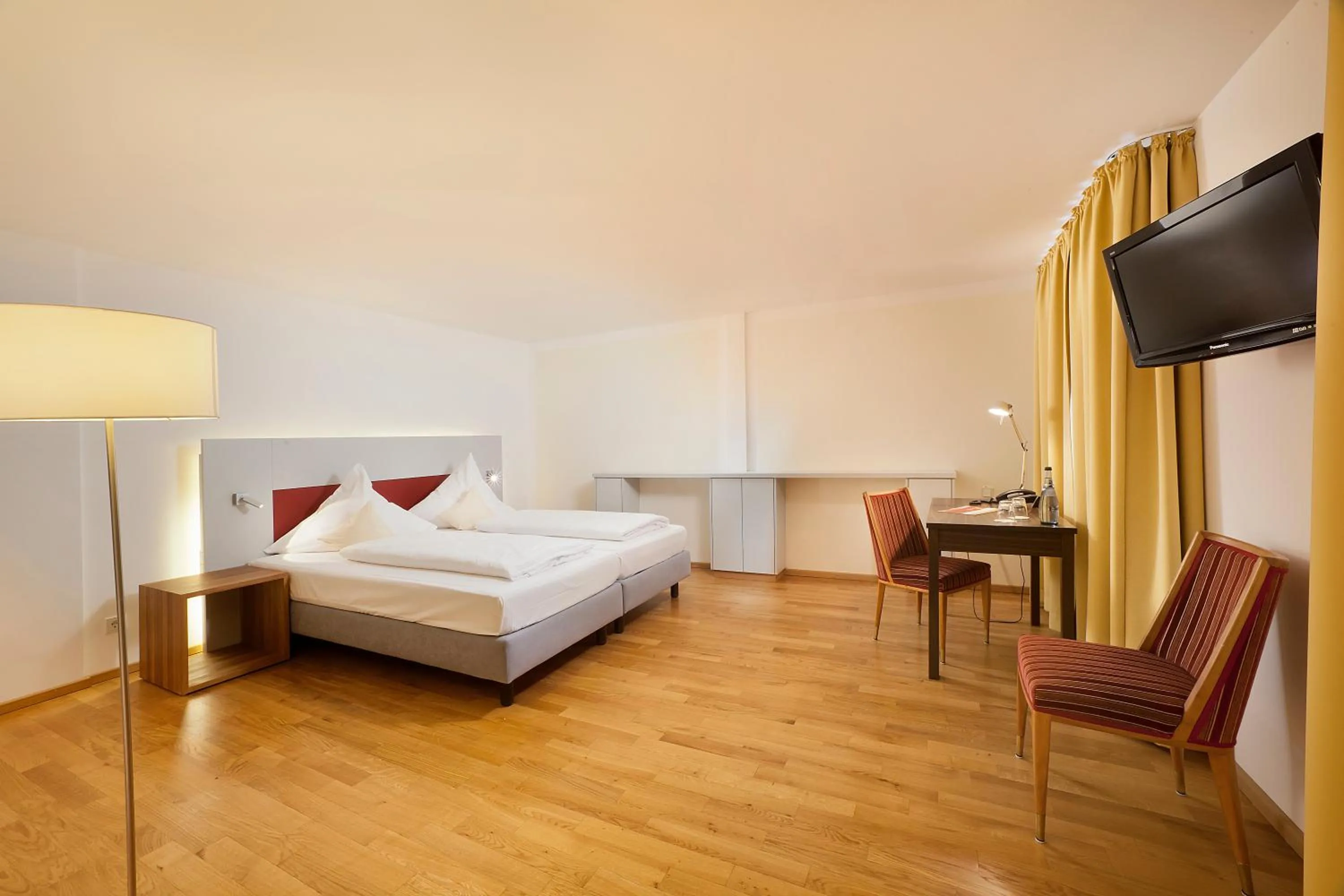 Photo of the whole room, Bed in AKZENT Brauerei Hotel Hirsch