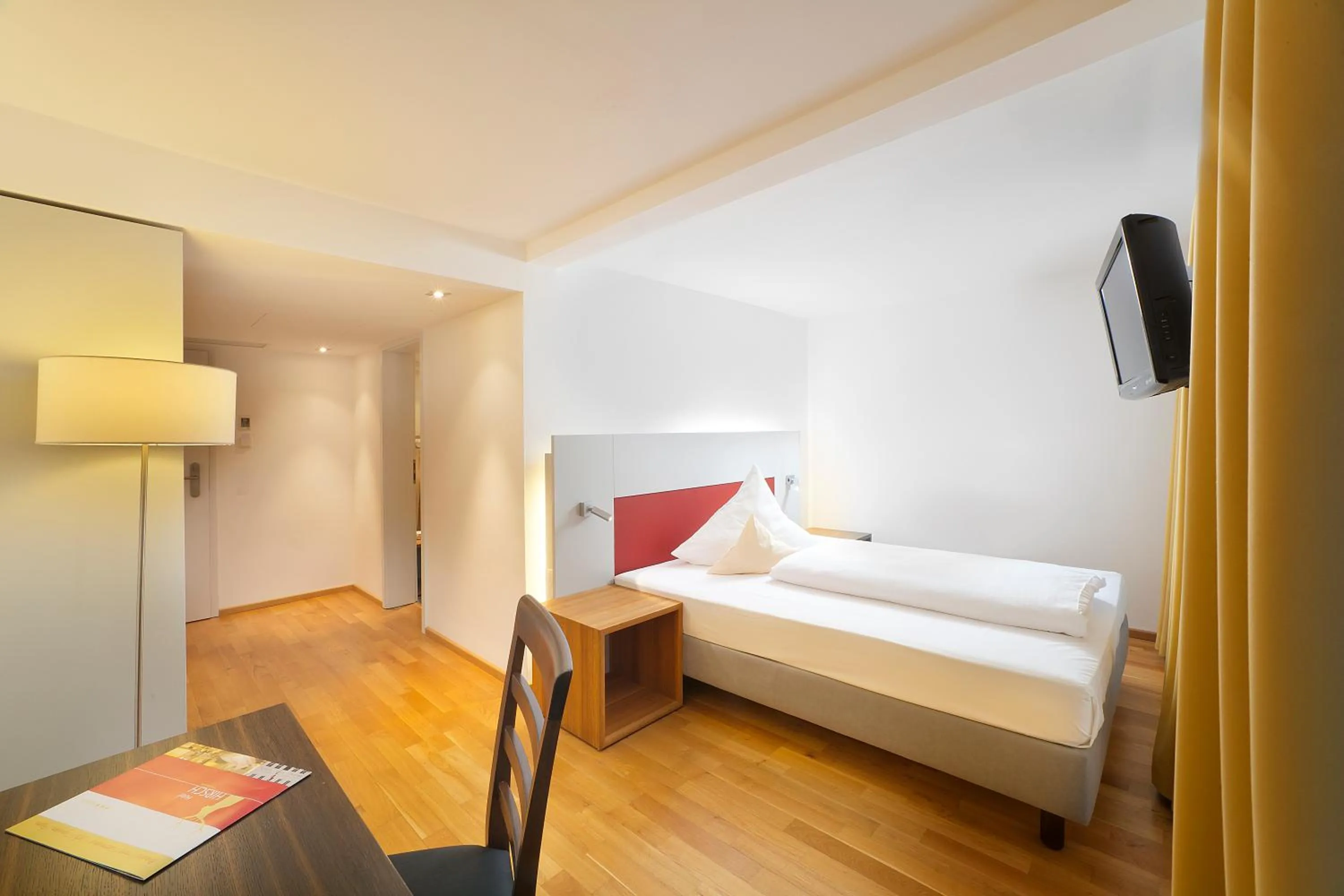 Photo of the whole room, Bed in AKZENT Brauerei Hotel Hirsch