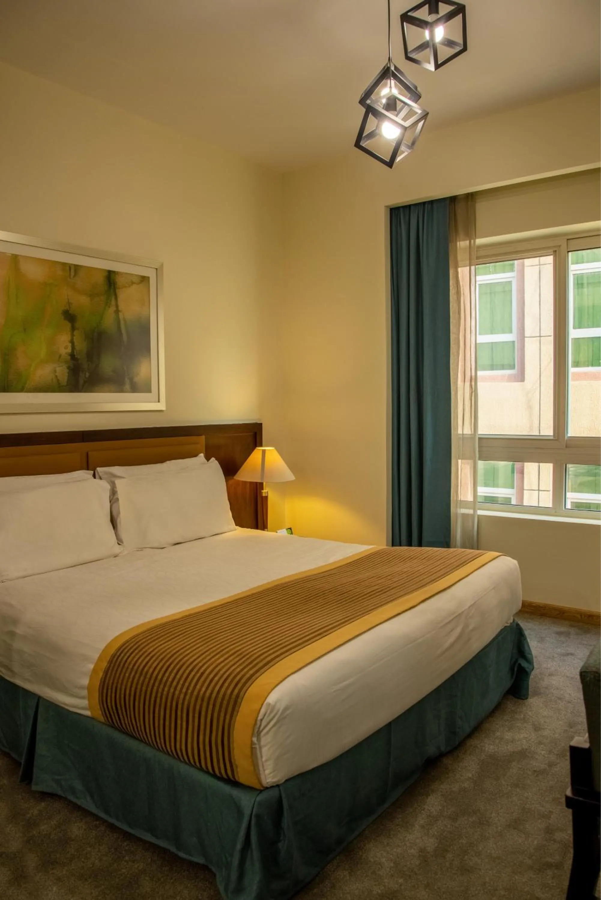 Bed in TIME Ruby Hotel Apartment