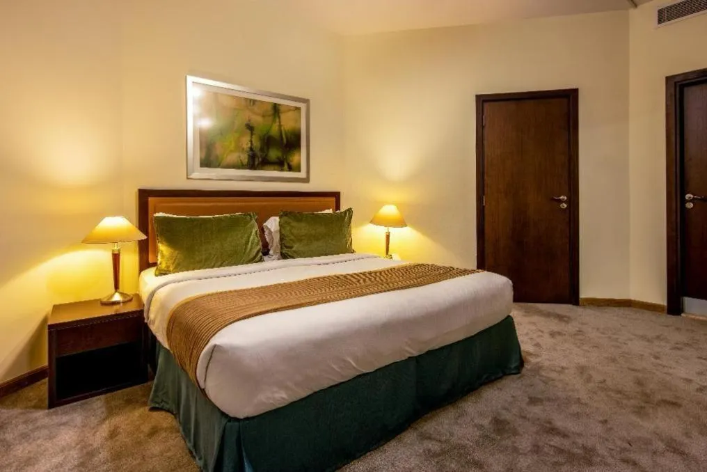 Bed in TIME Ruby Hotel Apartment