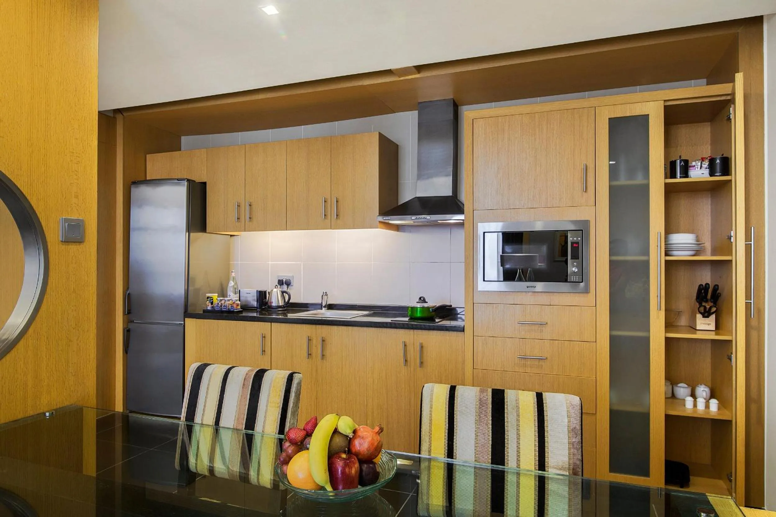 Kitchen or kitchenette in Hala Arjaan by Rotana, Deluxe Hotel Apartments