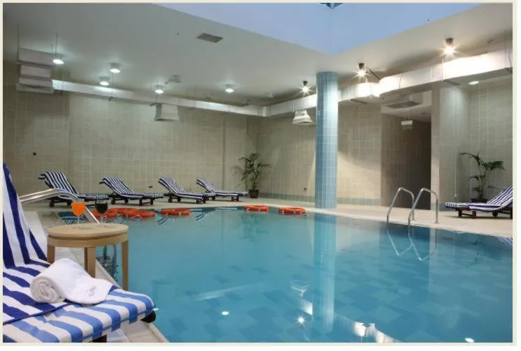 Swimming pool in L'Arabia Hotel Apartments