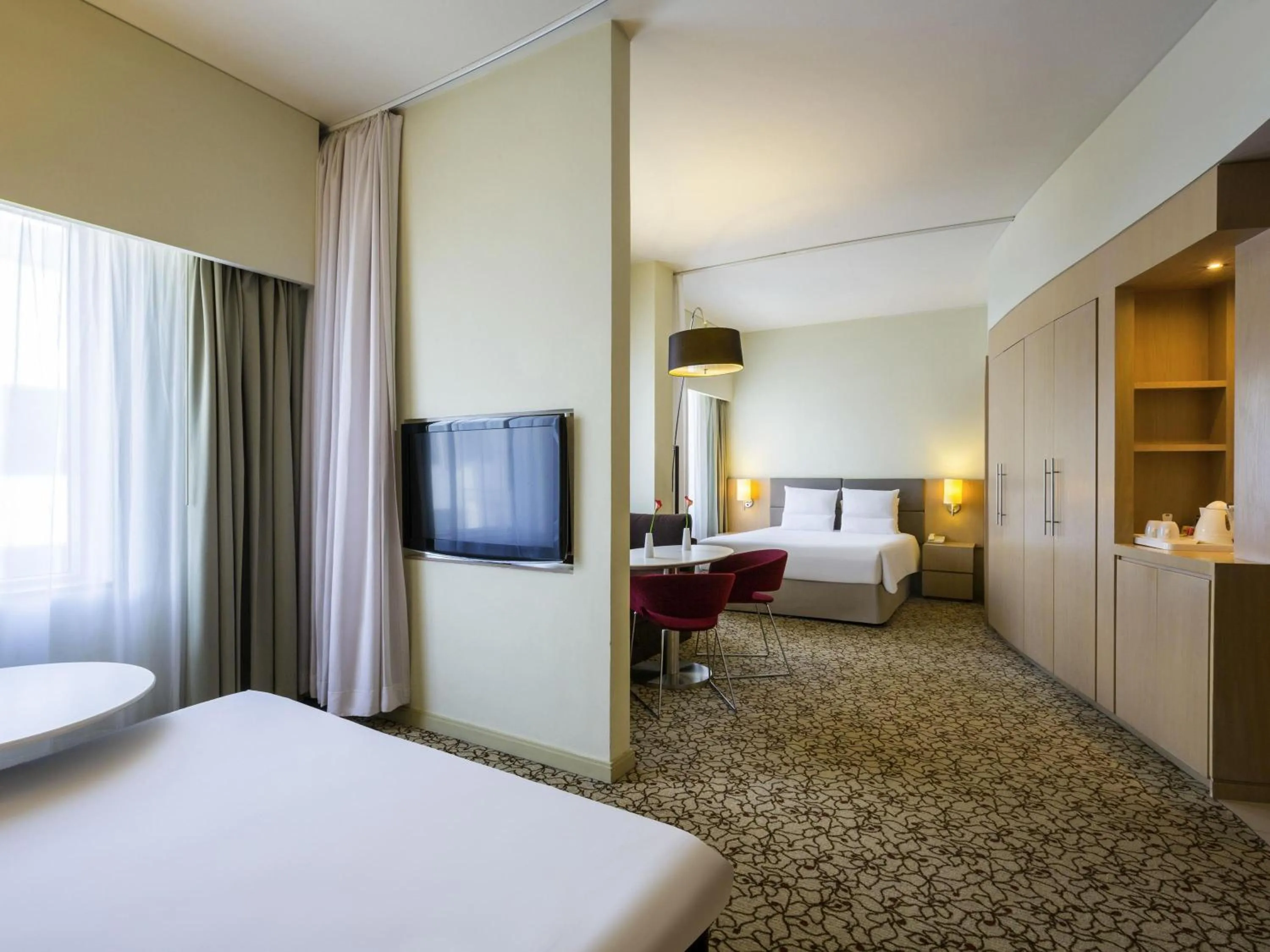 Bedroom, Bed in Novotel Suites Mall Avenue Dubai