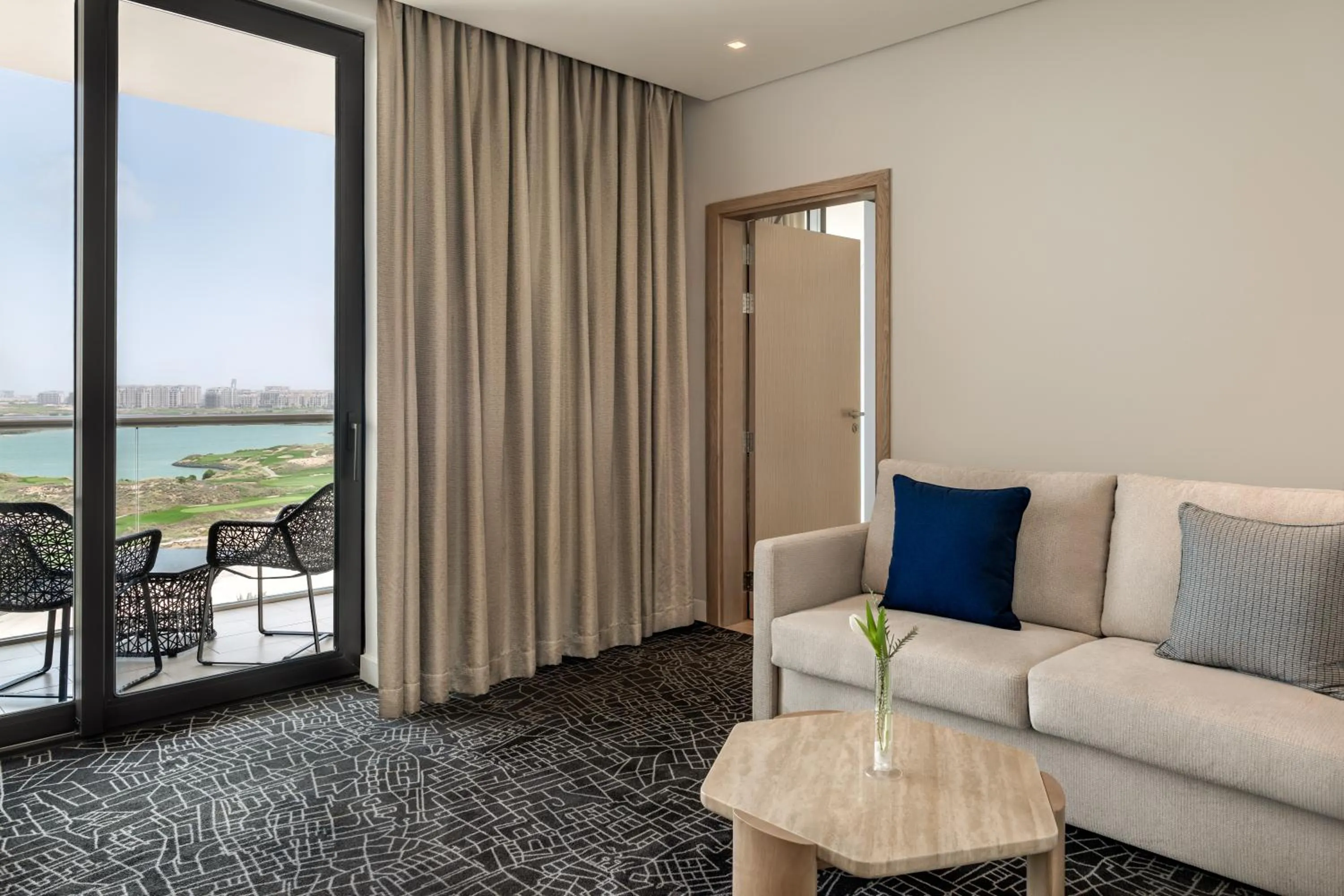 Living room in Yas Plaza Bay by IHG