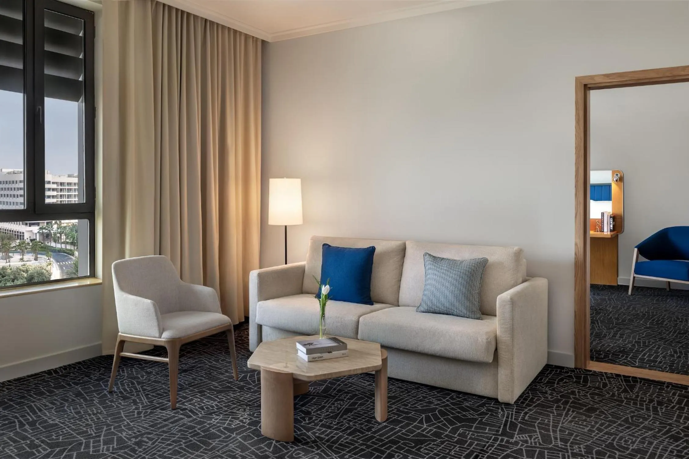 Living room in Yas Plaza Bay by IHG