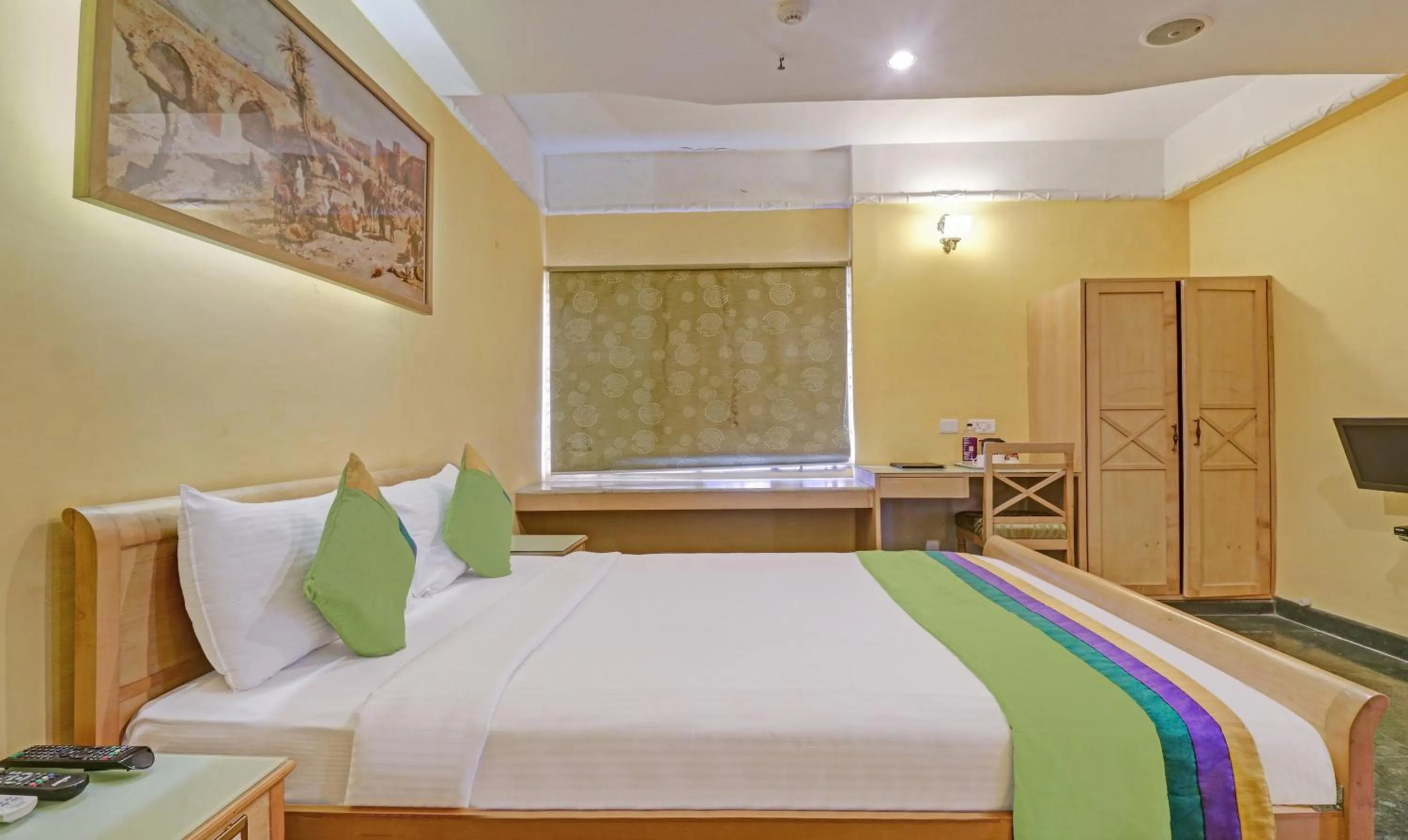 Bedroom, Bed in Treebo Komfort Suites, 3 Km From Mysore Palace