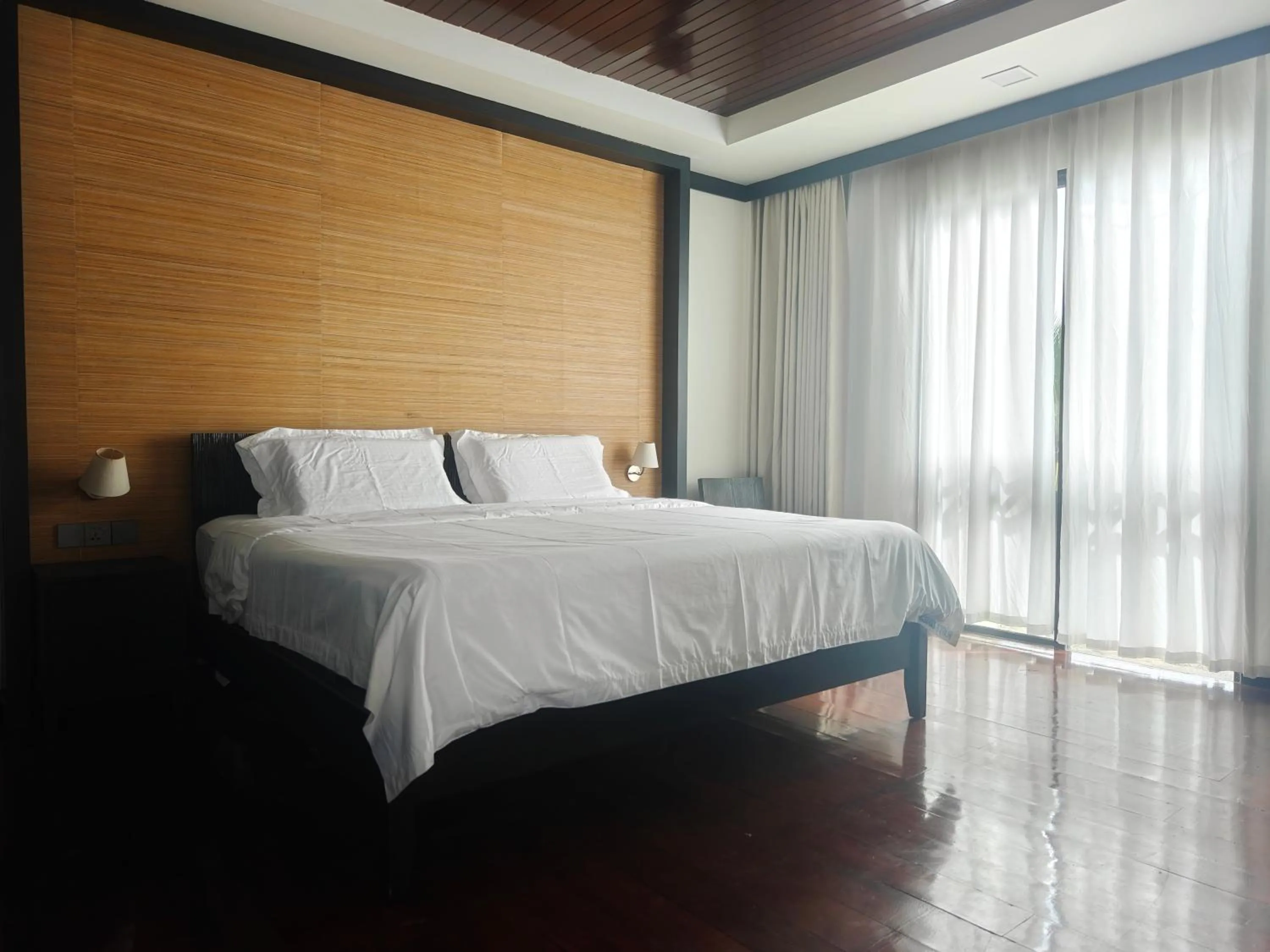 Bed in Sabah Beach Villas & Suites