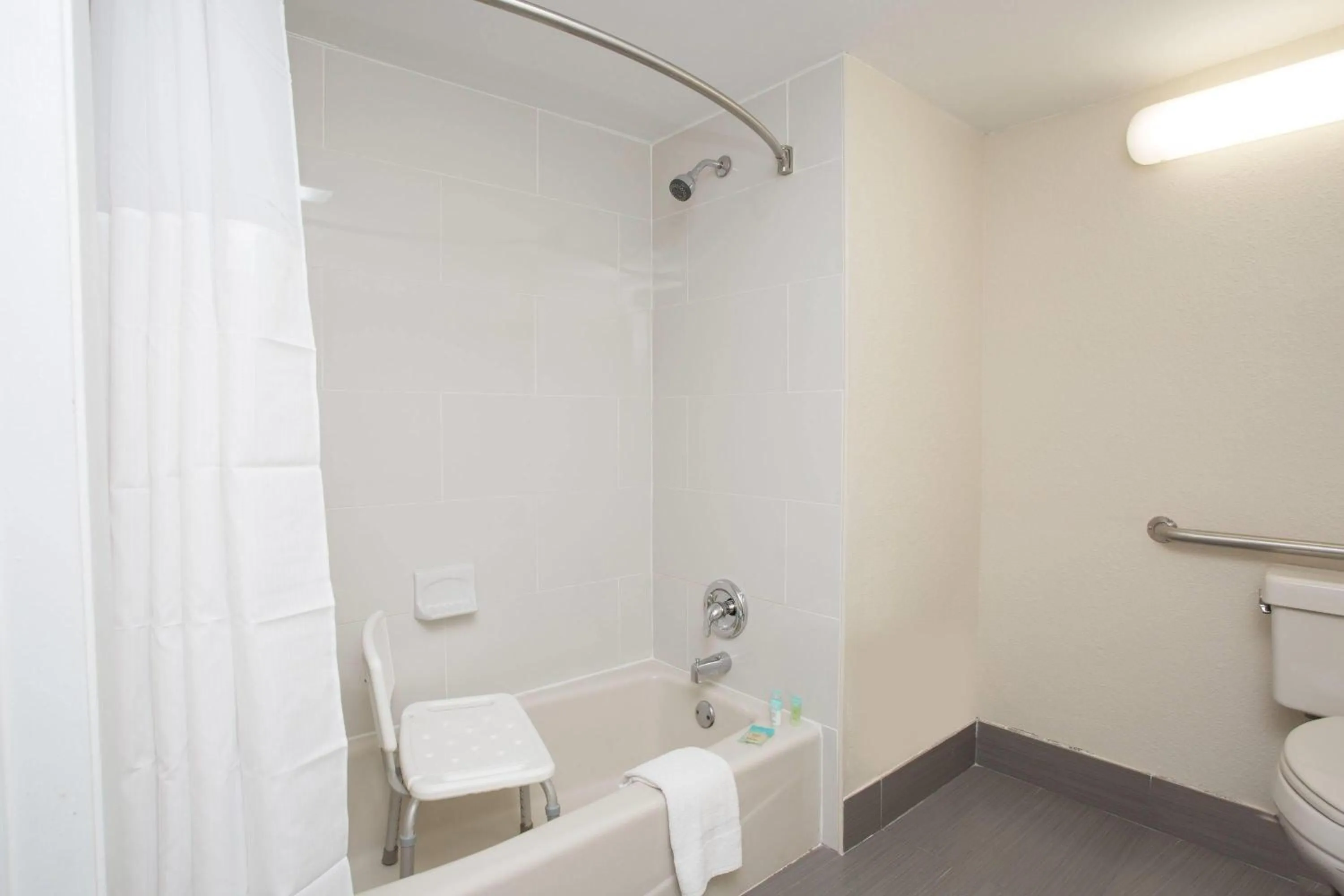 Bathroom in Days Inn & Suites by Wyndham Orlando Airport