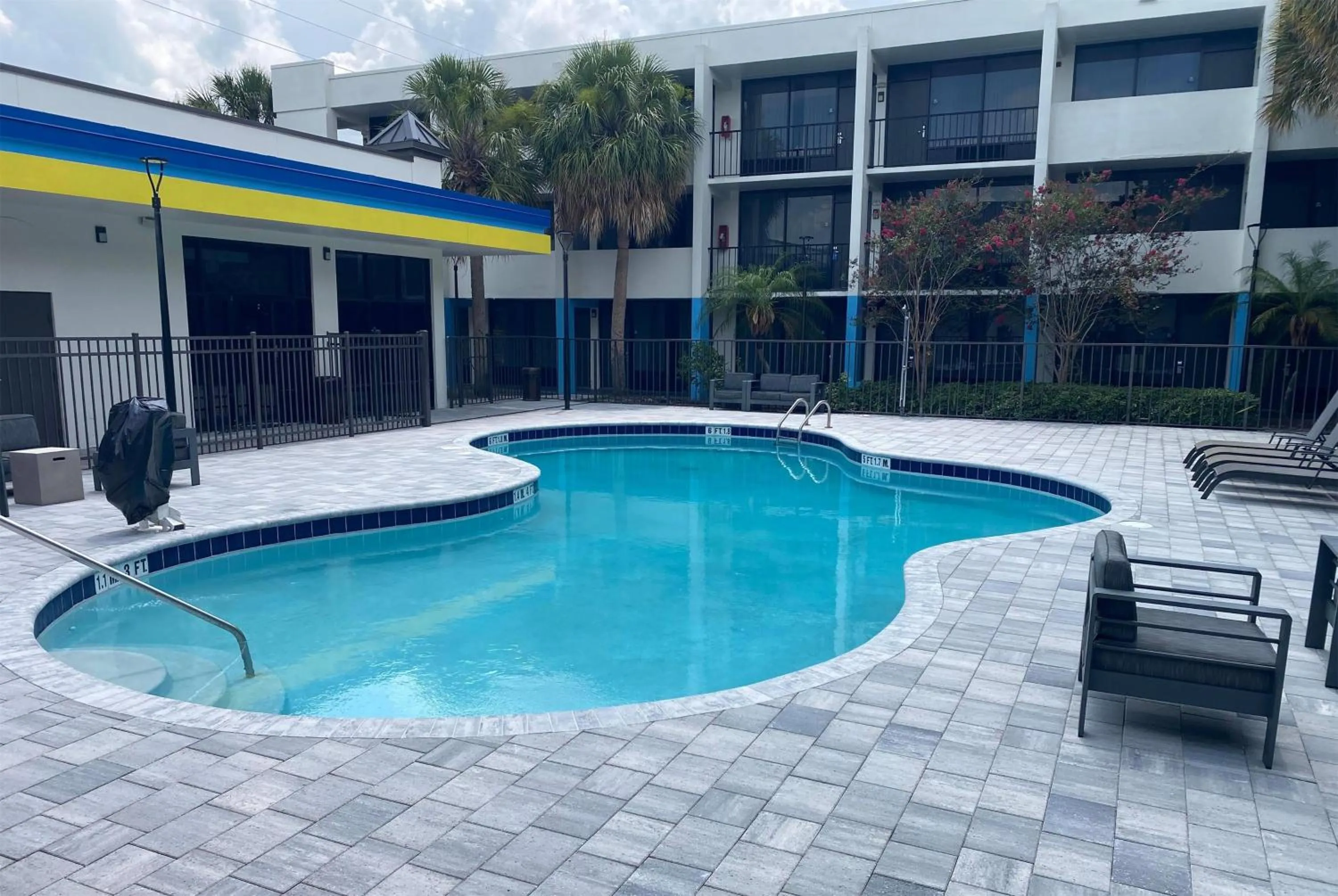 Pool view in Days Inn & Suites by Wyndham Orlando Airport