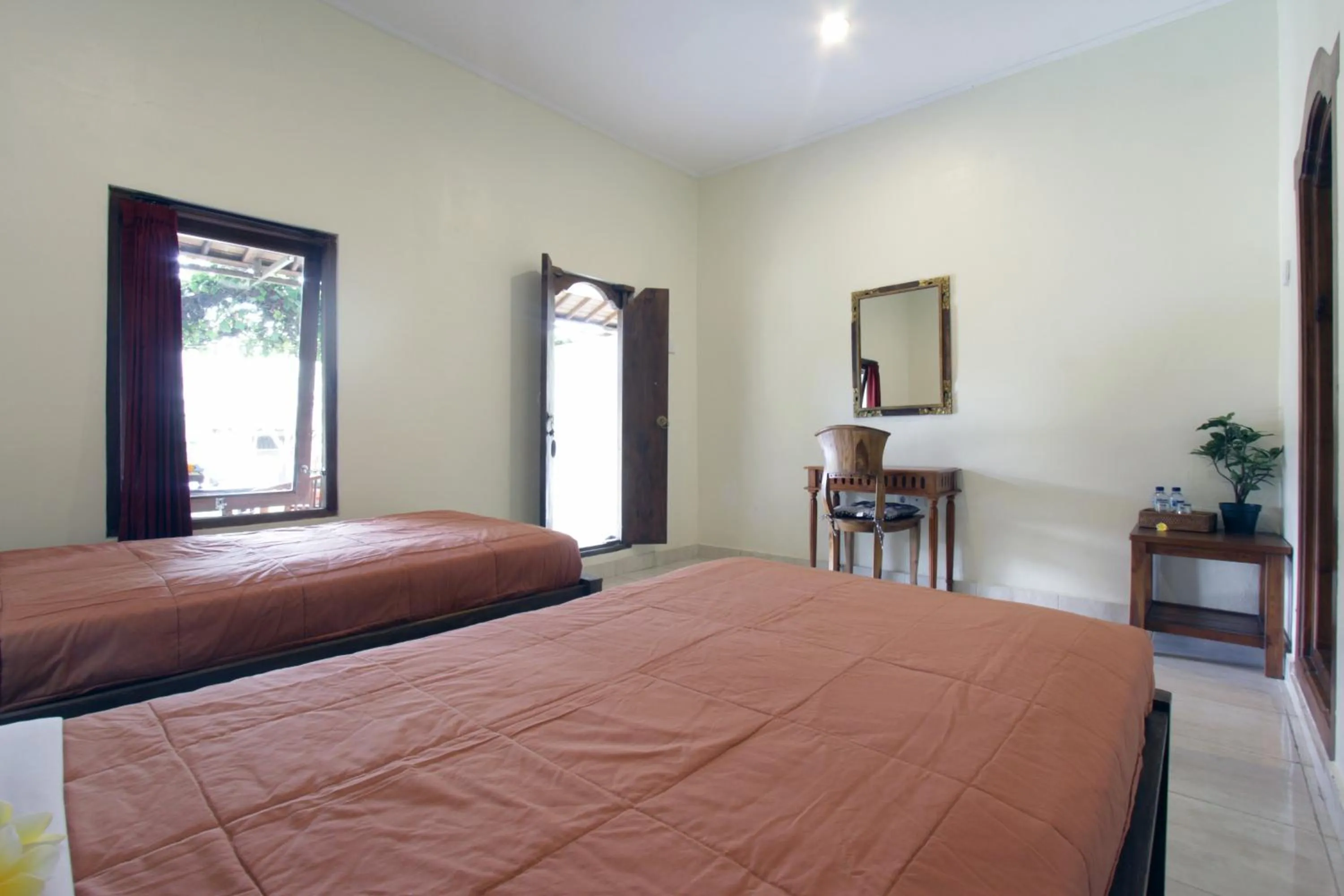 Bed in Nara Ubud Cottage by Mahaputra