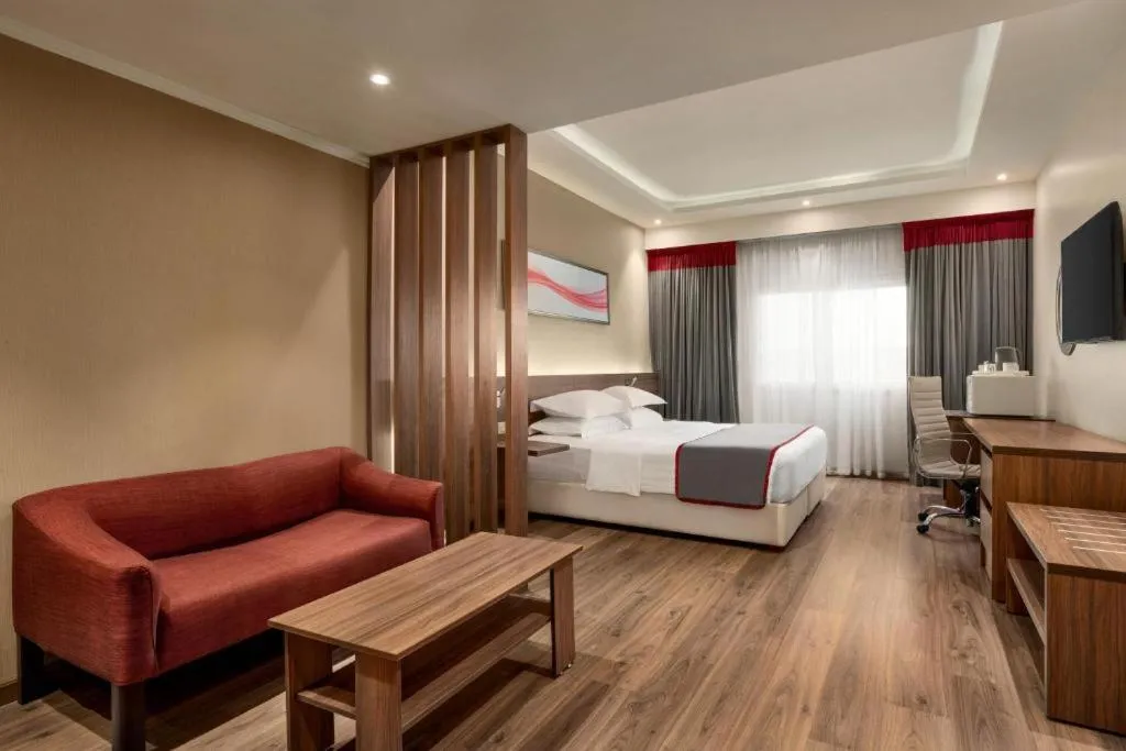 TV and multimedia, Bed in Eastyard Dammam Hotel - Formerly Ramada by Wyndham Dammam