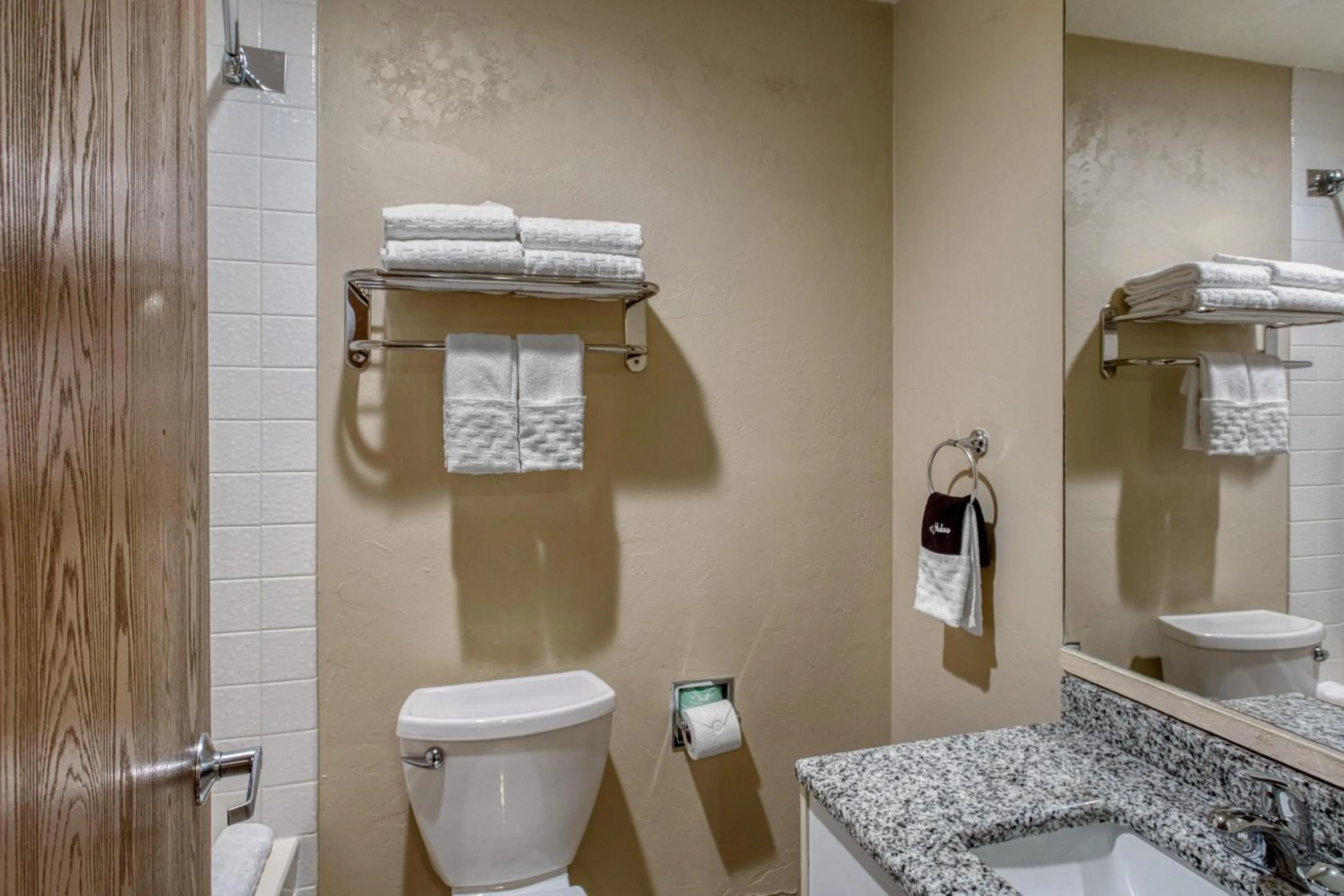Bathroom in SureStay Plus Hotel by Best Western Price
