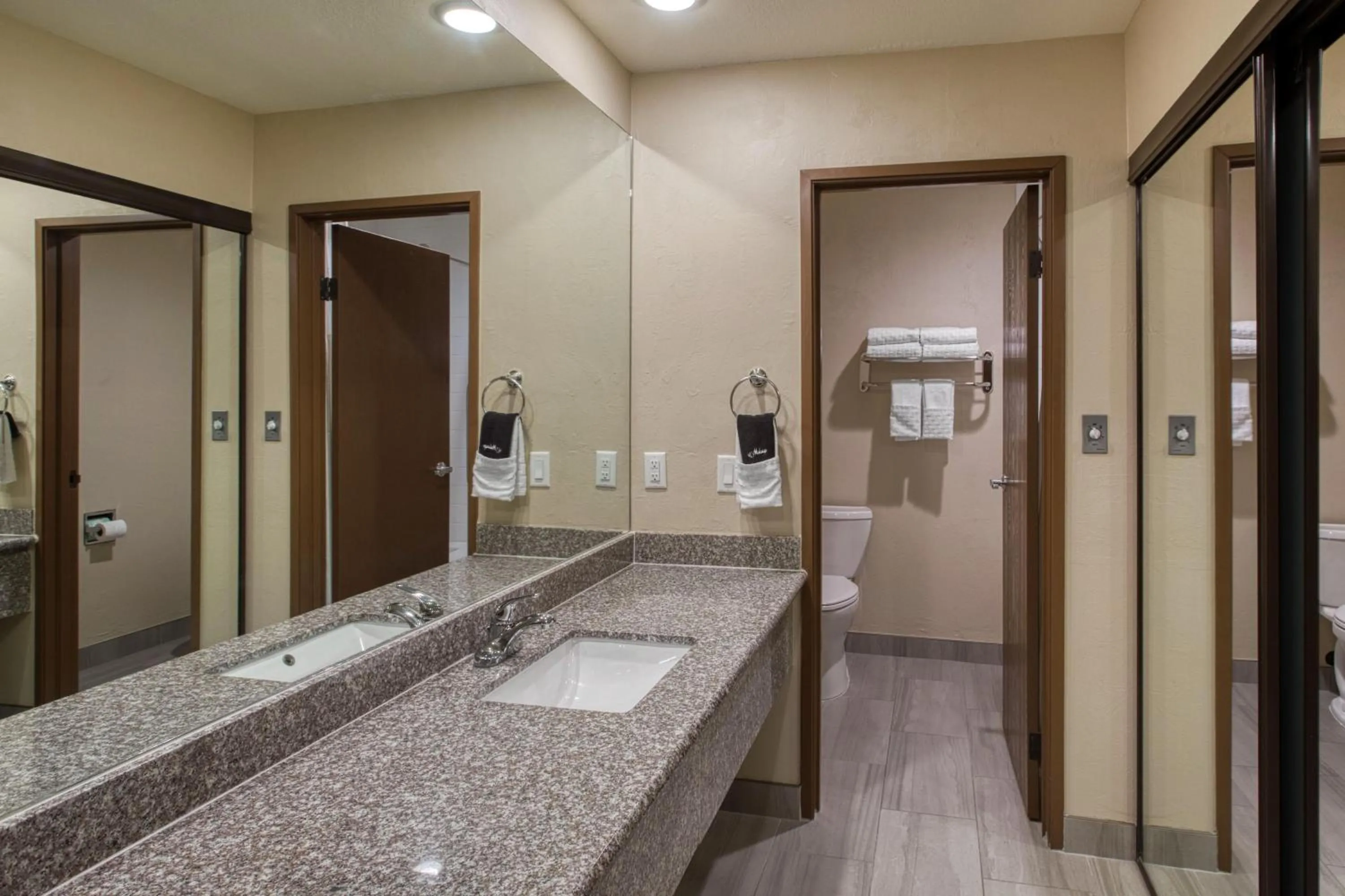 Bathroom in SureStay Plus Hotel by Best Western Price