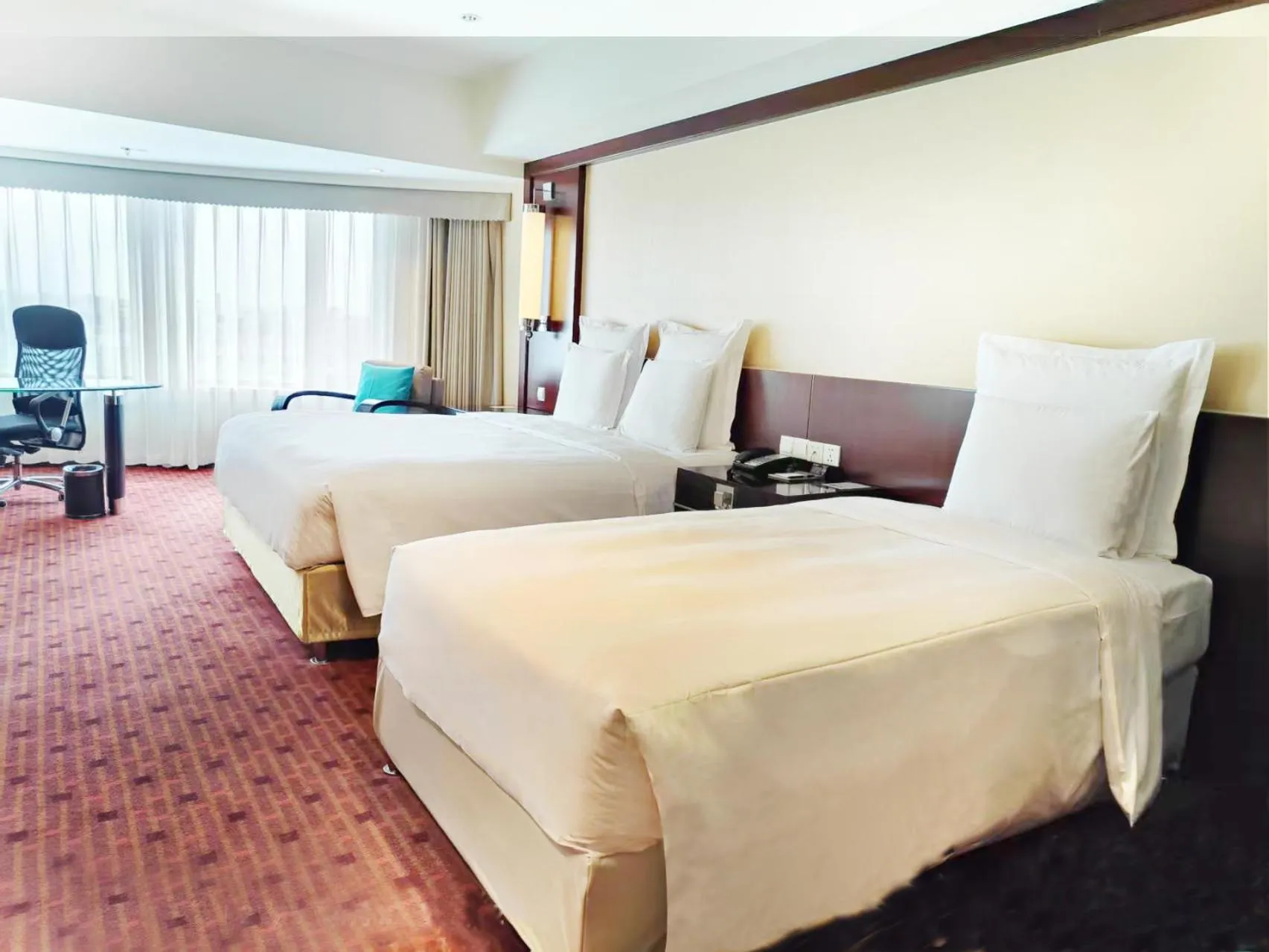 Bed in Beijing Pudi Hotel