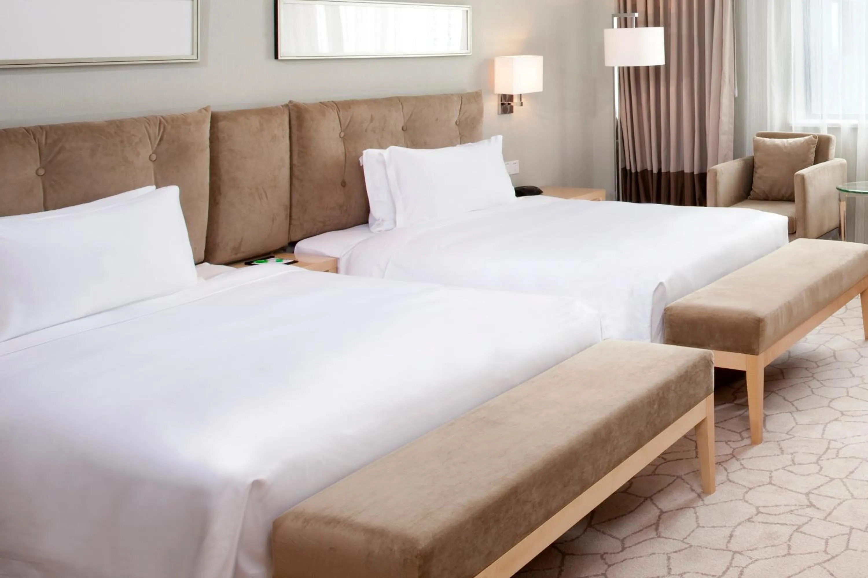 Bed in Holiday Inn Beijing Deshengmen by IHG on 2nd Ring Road Extension 10-15 minute taxi ride to Shichahai Lama Temple Drum Tower Close to Beijing North Station for Badaling Great Wall Near Exit B Jishuitan Metro Line 2