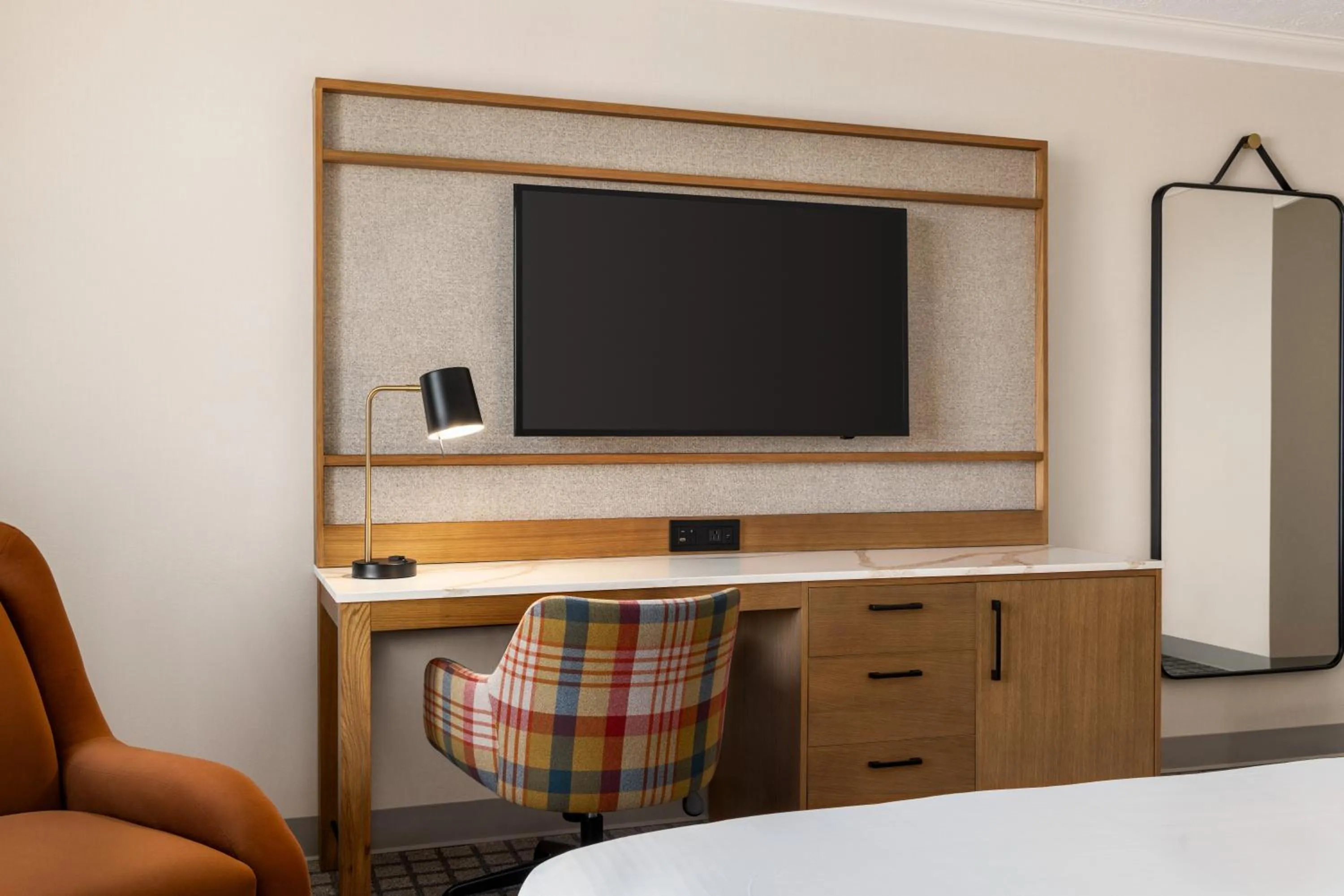 Seating area, Bed in Crowne Plaza Louisville Airport Expo Ctr by IHG