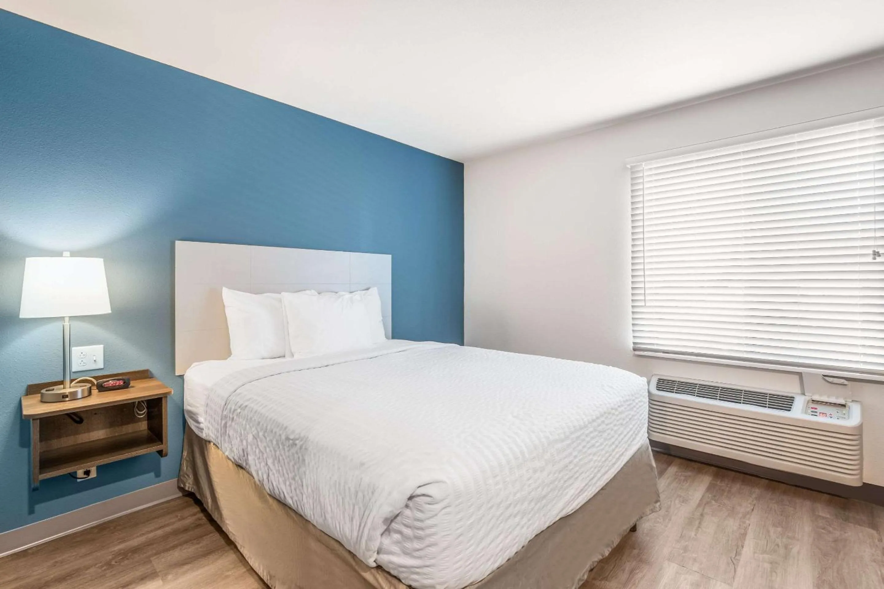 Photo of the whole room, Bed in WoodSpring Suites Chicago Midway