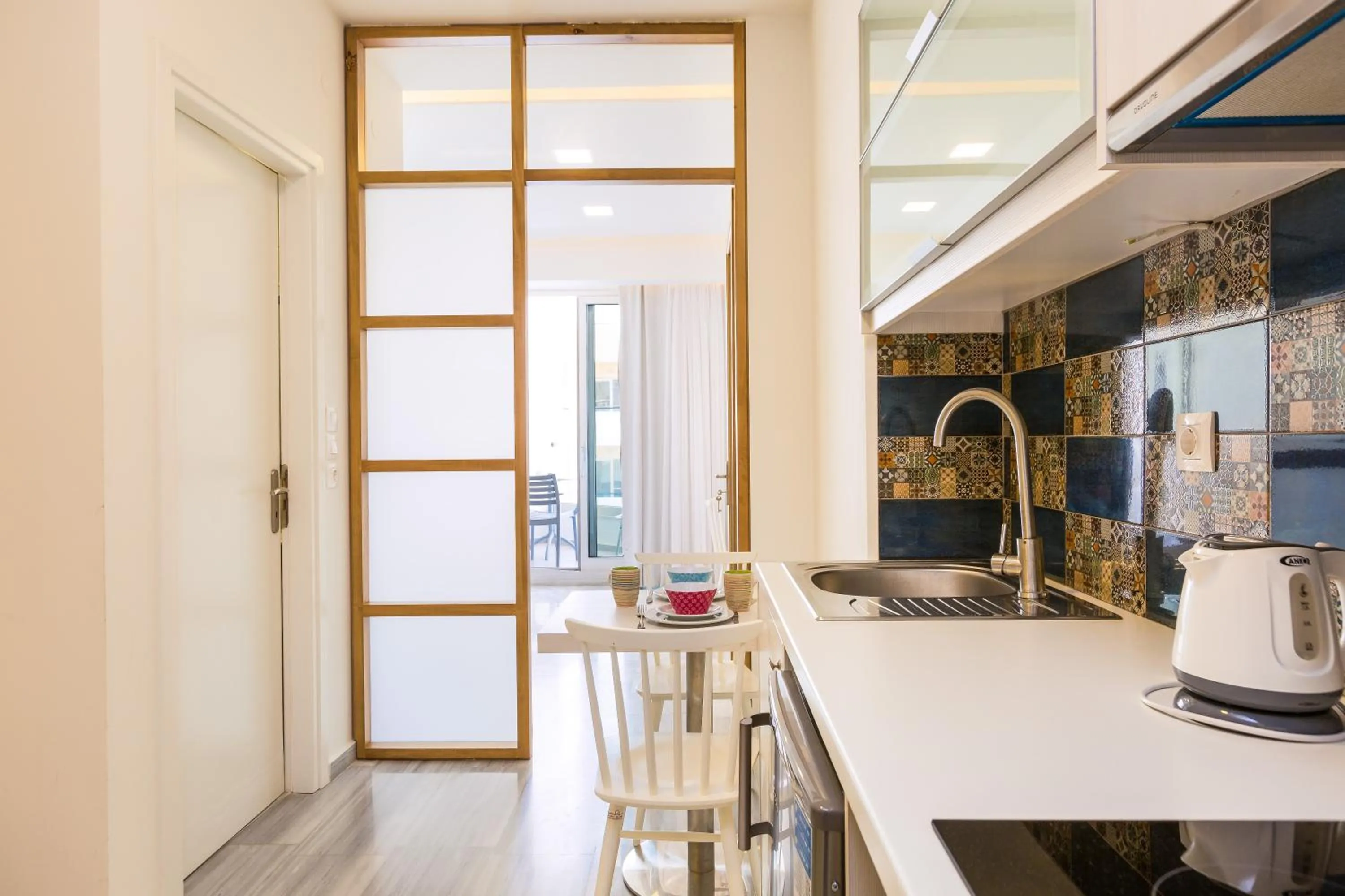 Kitchen or kitchenette in Meltemi Coast Suites