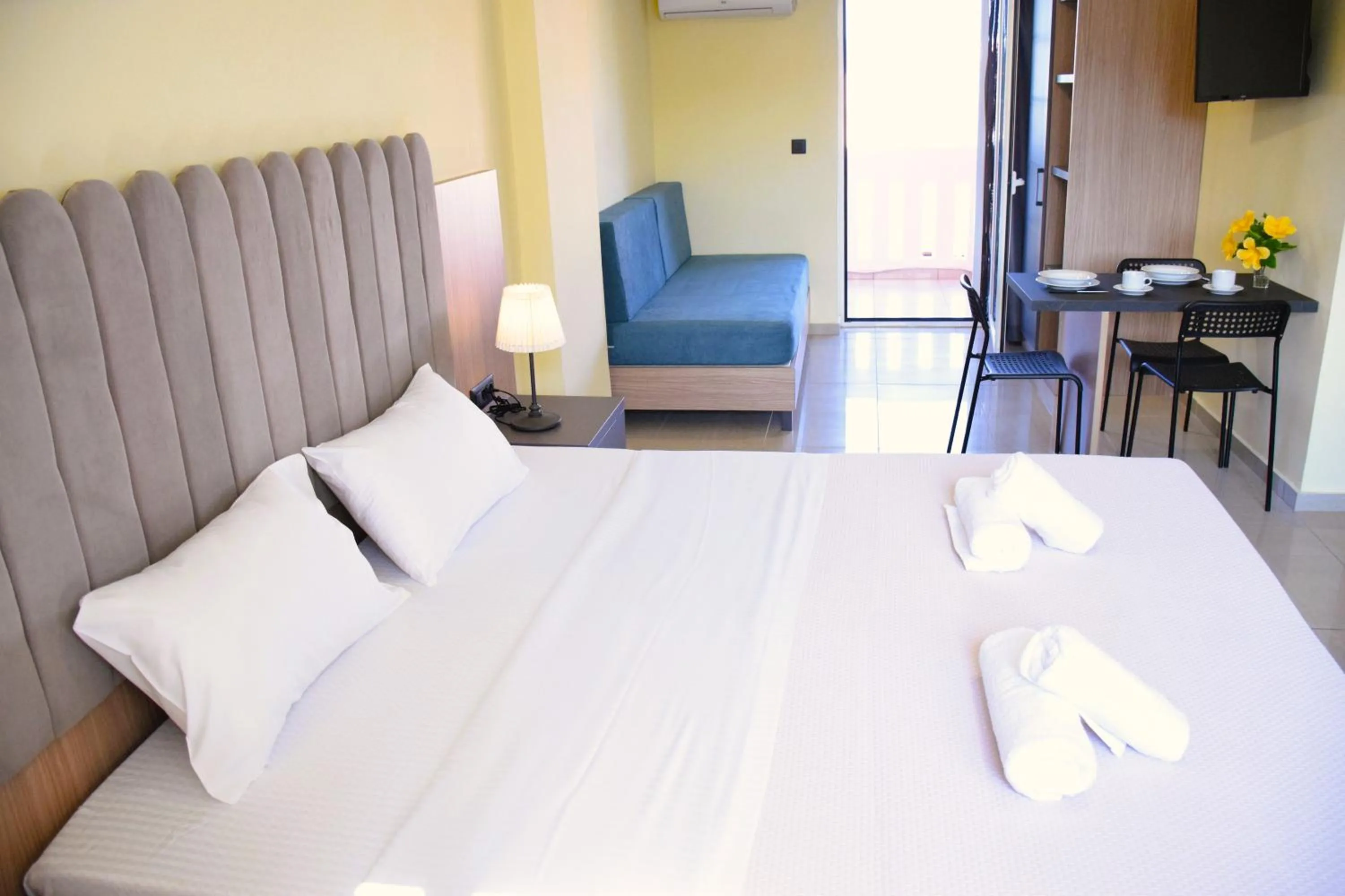 Seating area, Bed in Eden Beach Hotel