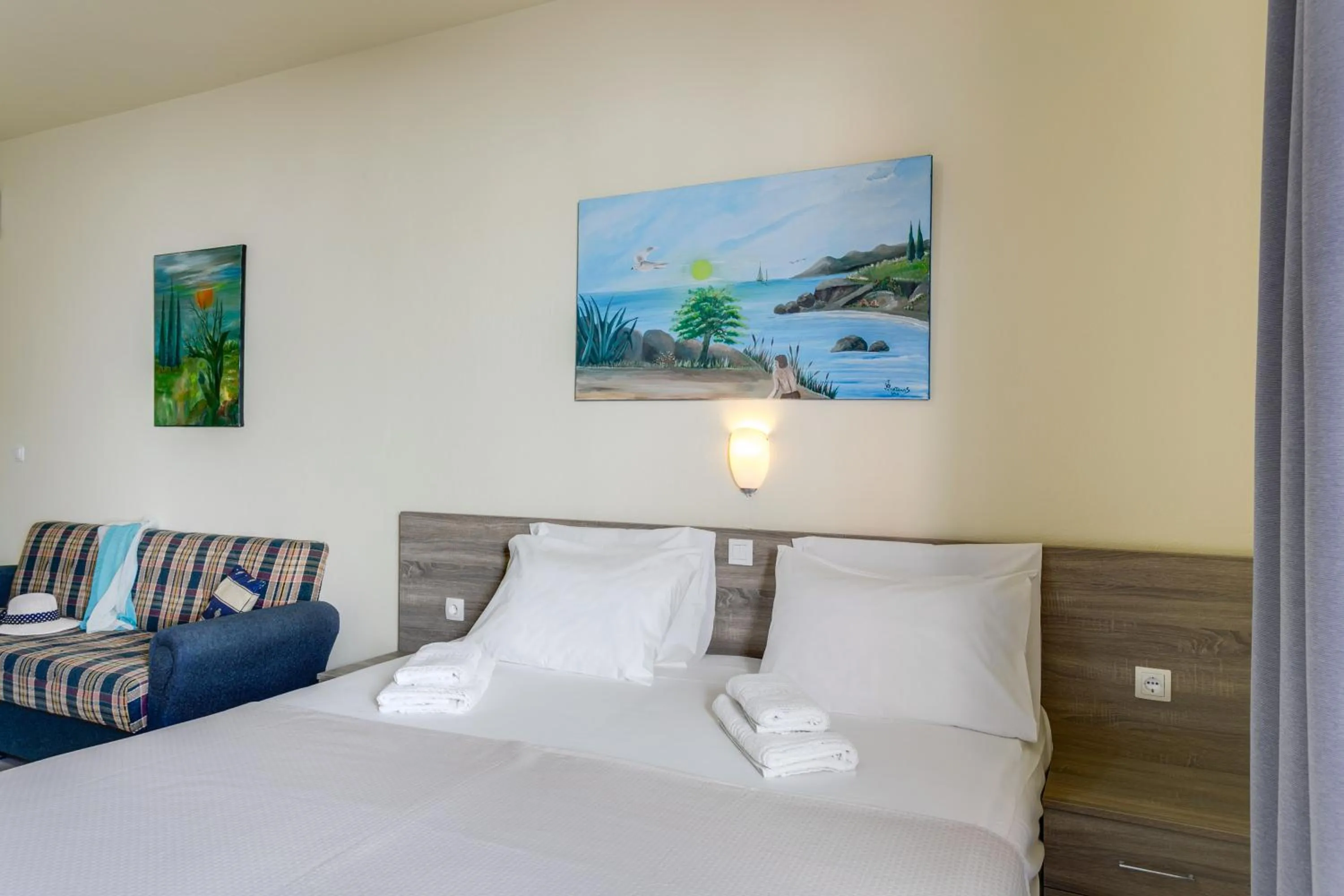 Bed in Eden Beach Hotel