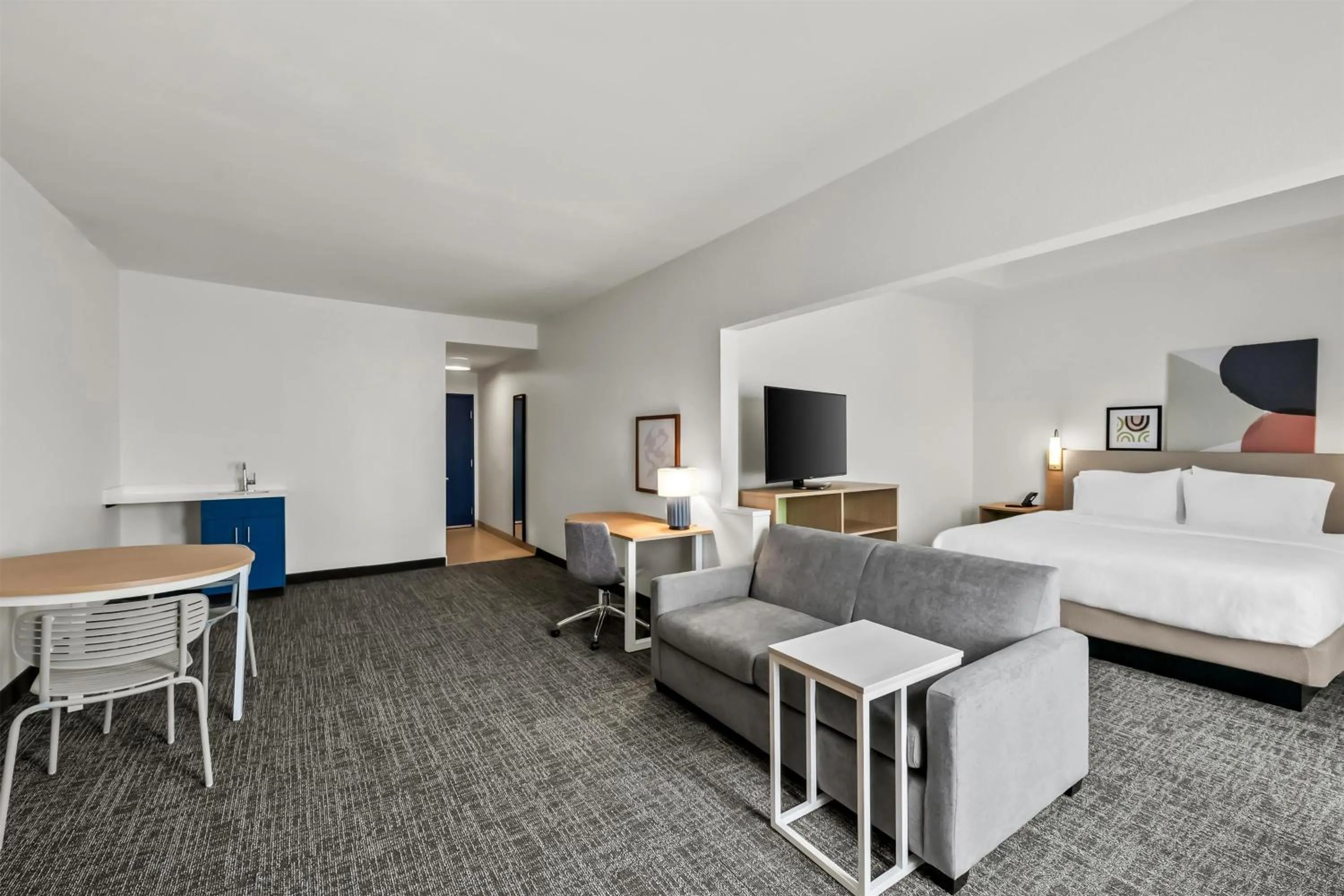 Living room, Bed in Spark by Hilton Spring Lake Fayetteville