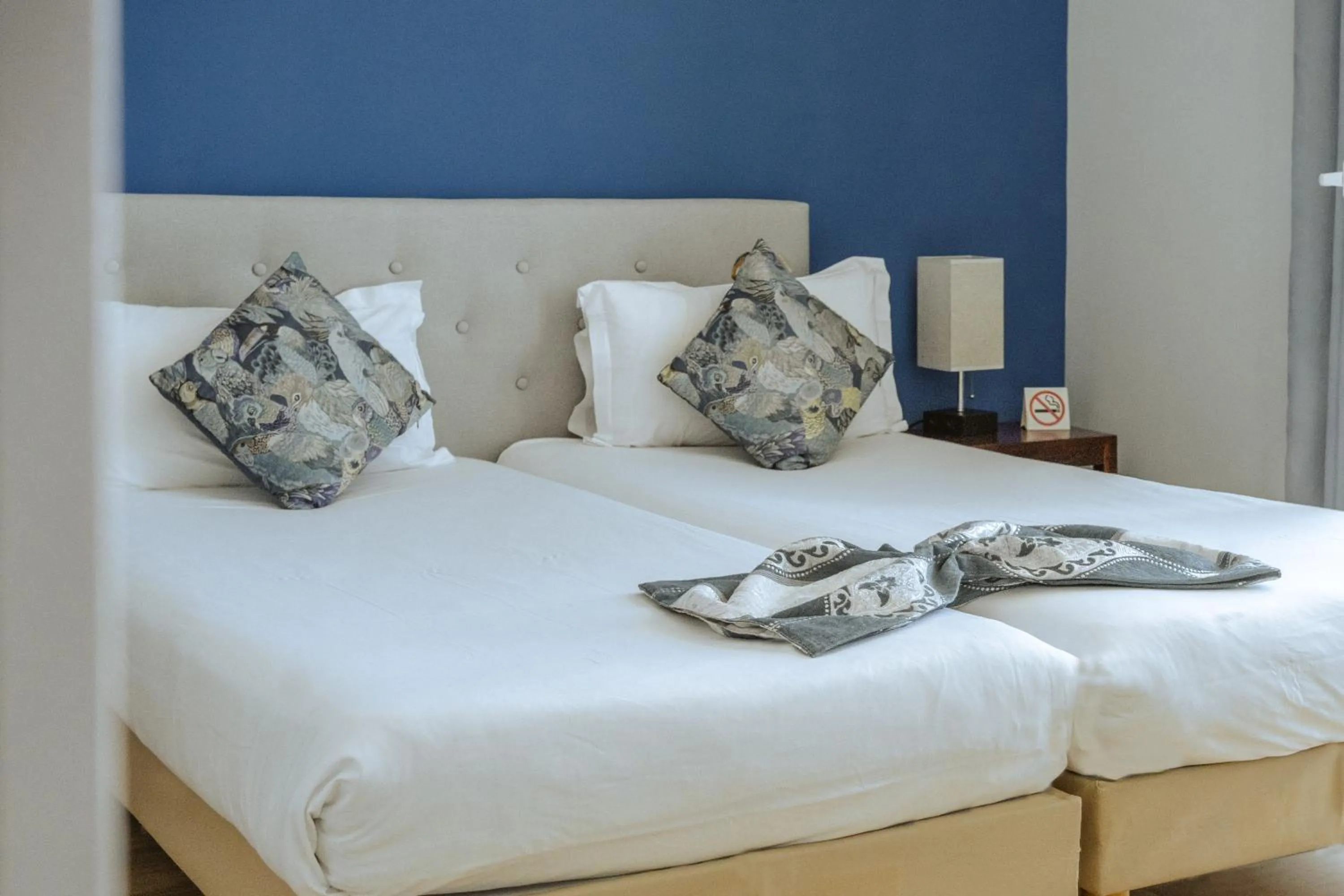 Bed in Hôtel du Bord de Mer "Le Vanillé"