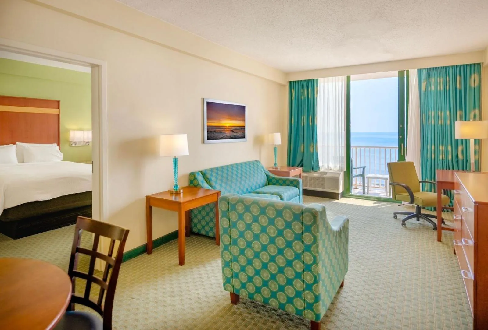 Living room, Bed in Holiday Inn & Suites Virginia Beach - North Beach by IHG