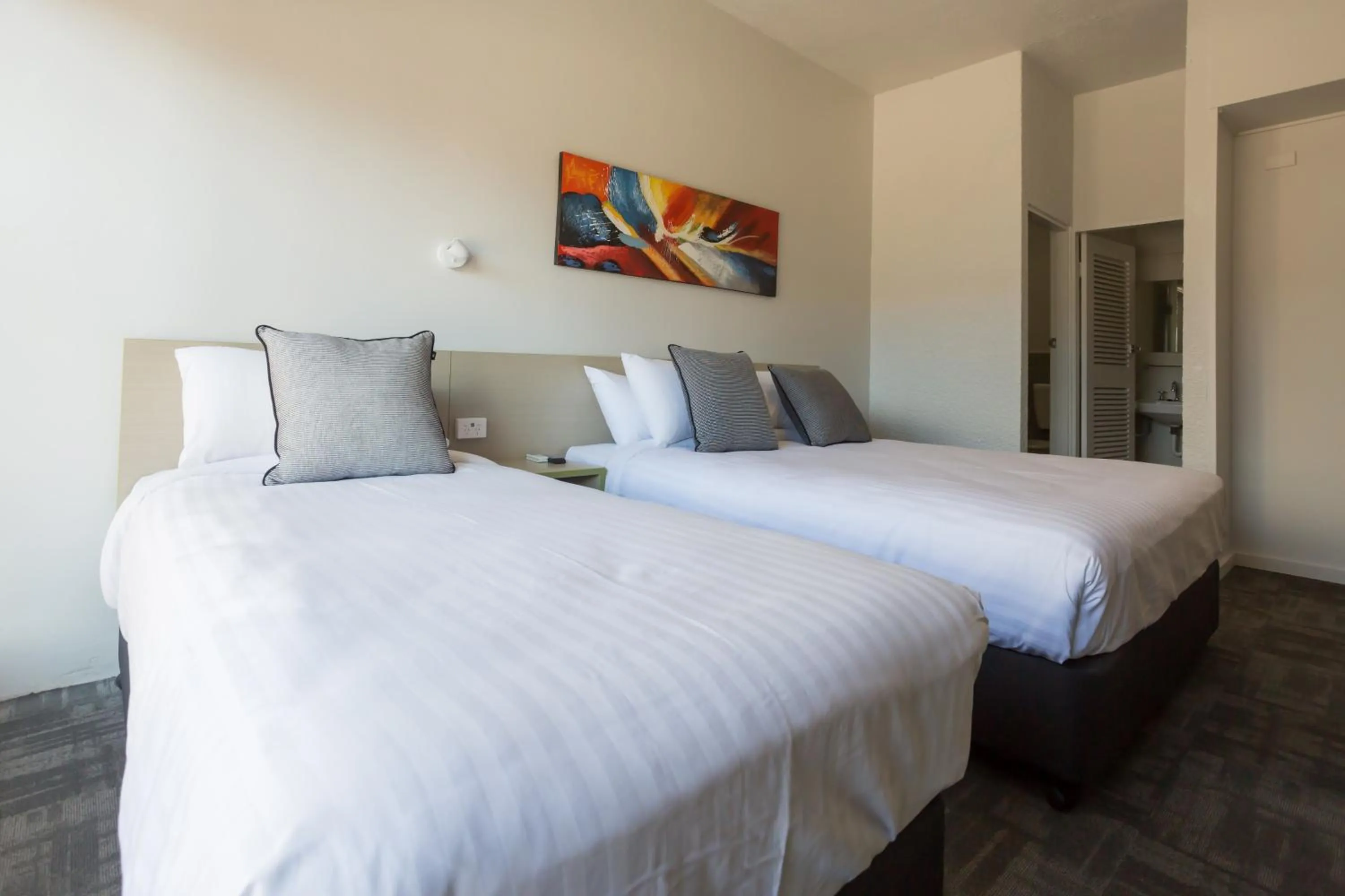 Photo of the whole room, Bed in Nightcap at Emerald Star Hotel