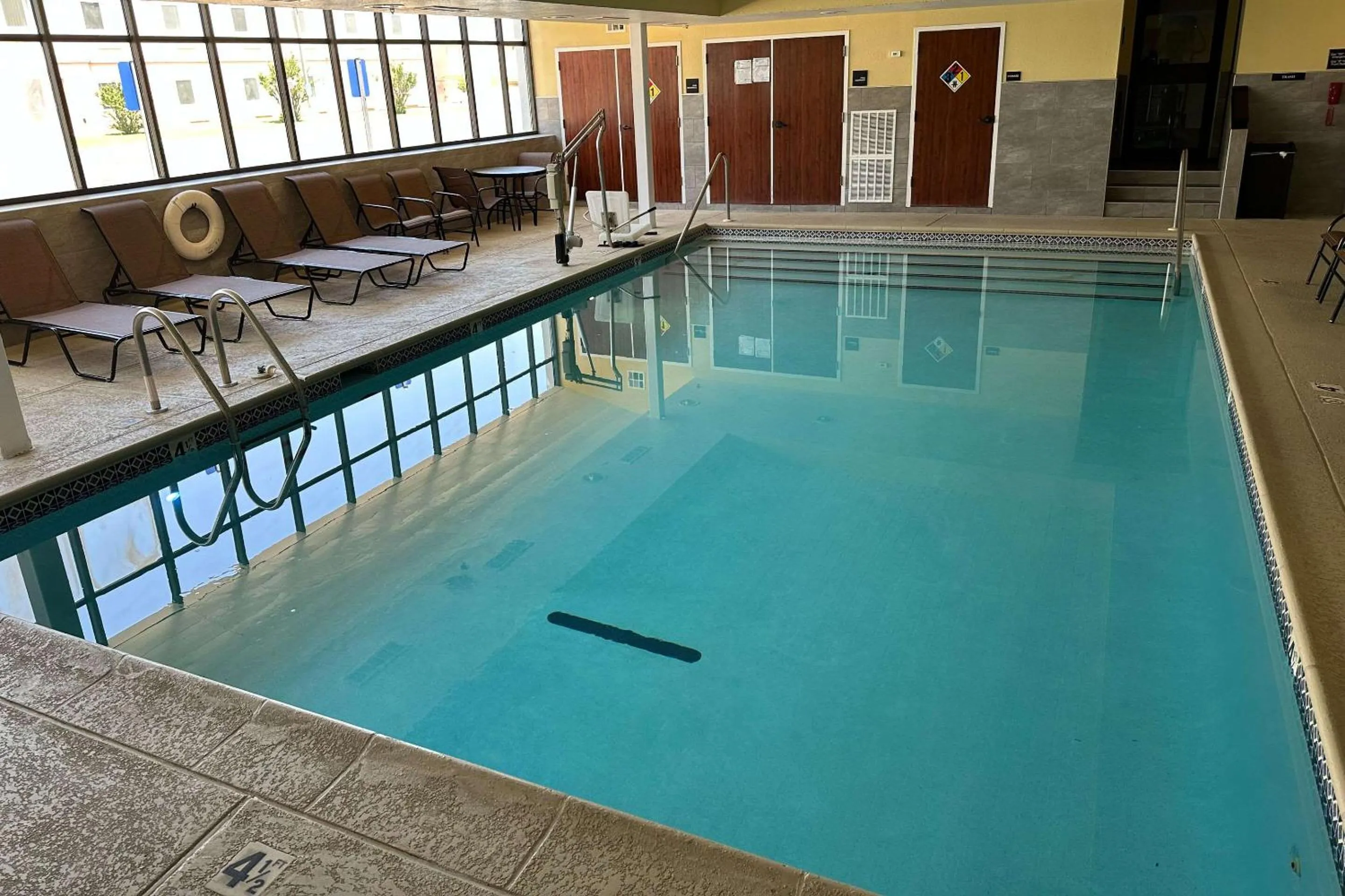Swimming pool in SureStay Plus Hotel by Best Western Norman