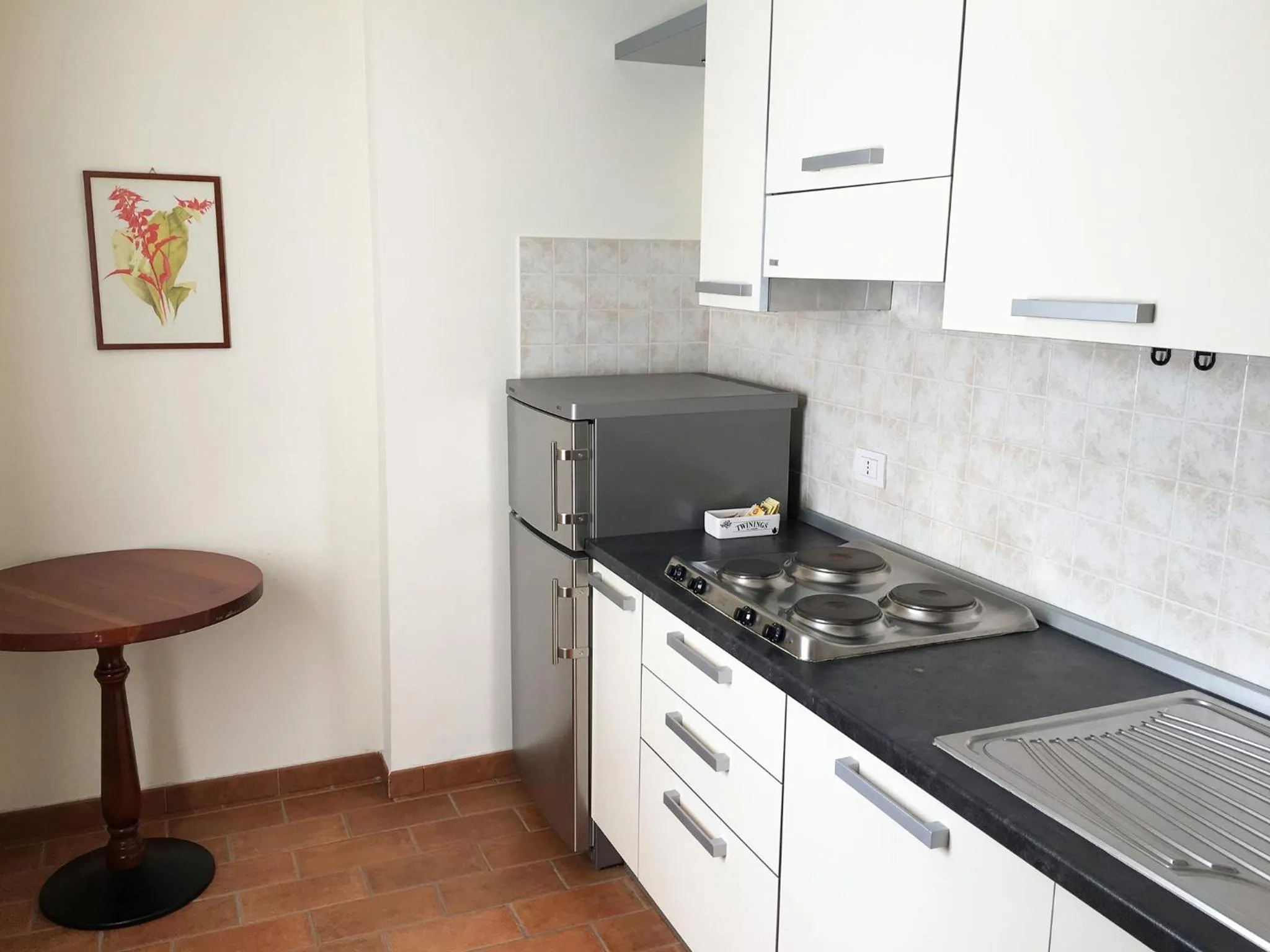 Kitchen or kitchenette in R.T.A. Hotel Monte Rosa