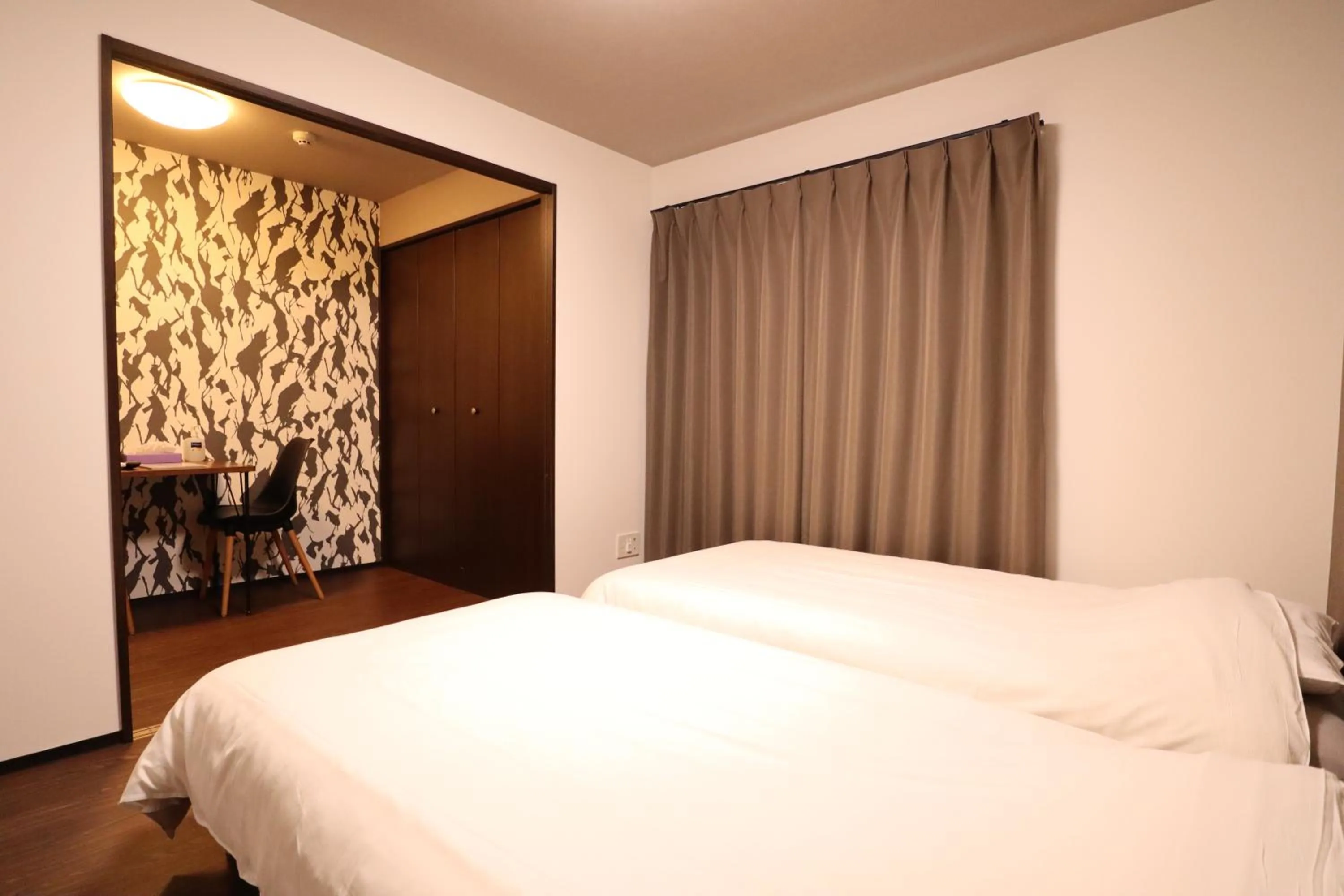 Bed in Kyostay Iroha Toji Annex