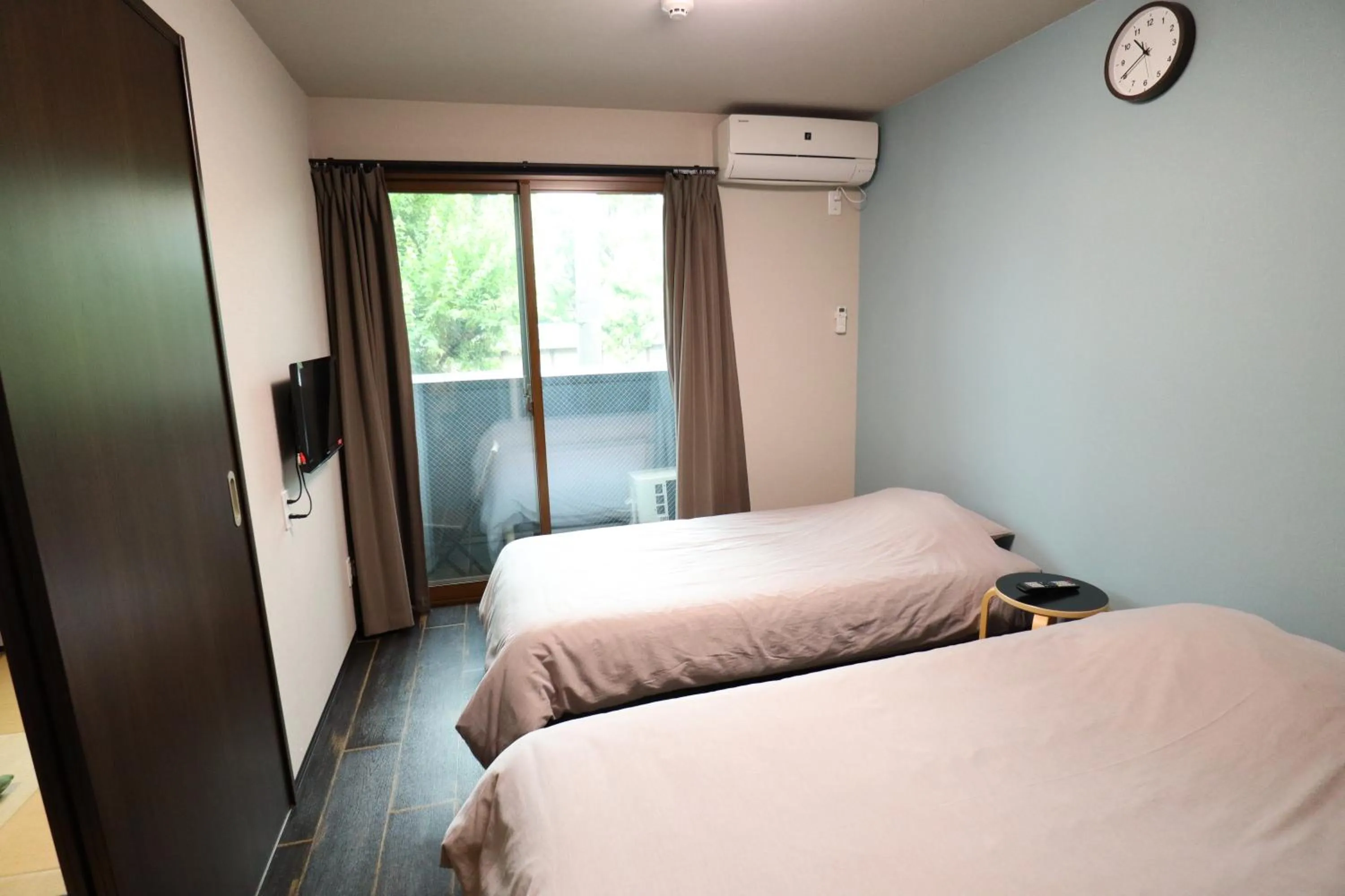 Bed in Kyostay Iroha Toji Annex