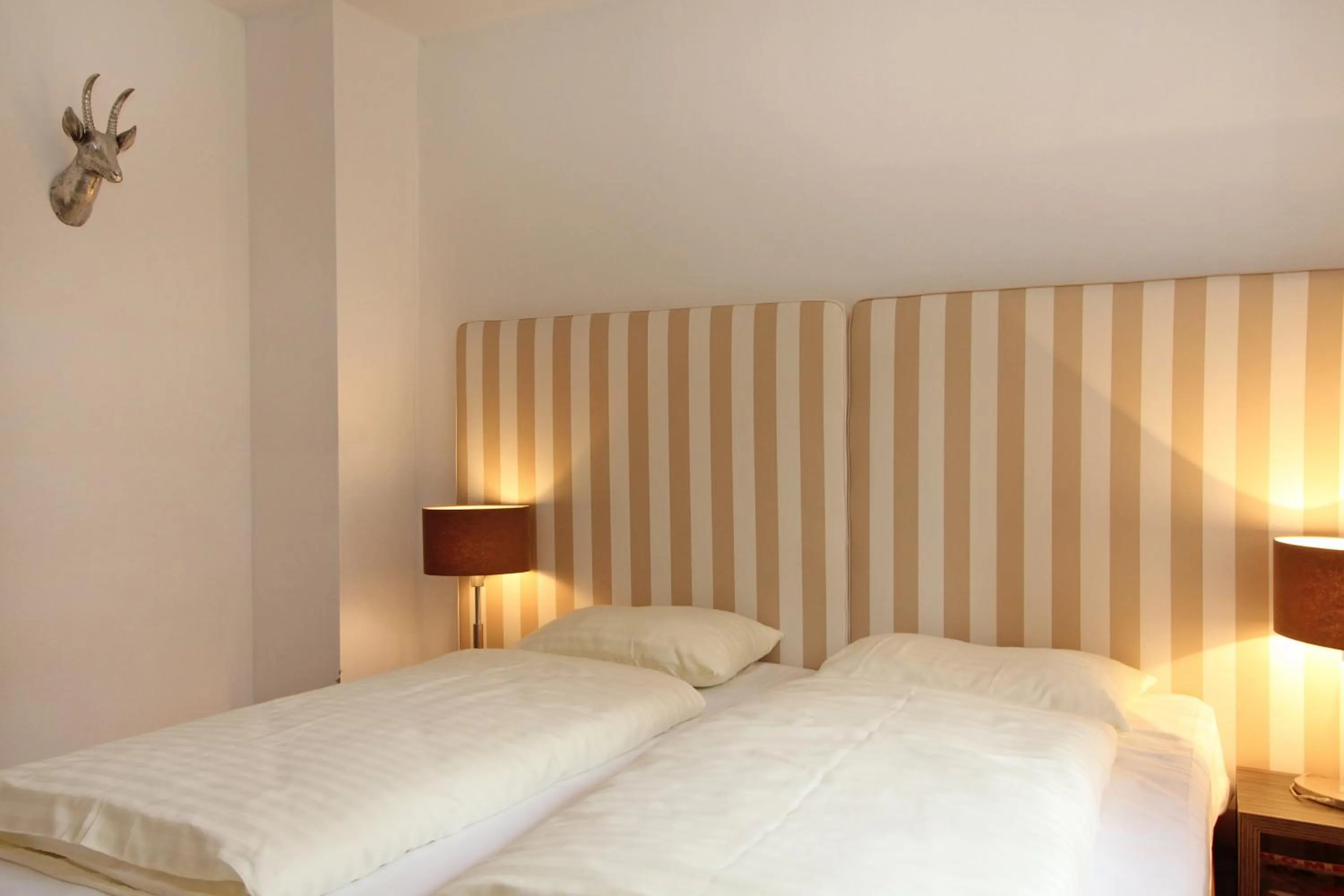 Bed in AvenidA Style Appartements by Alpin Rentals