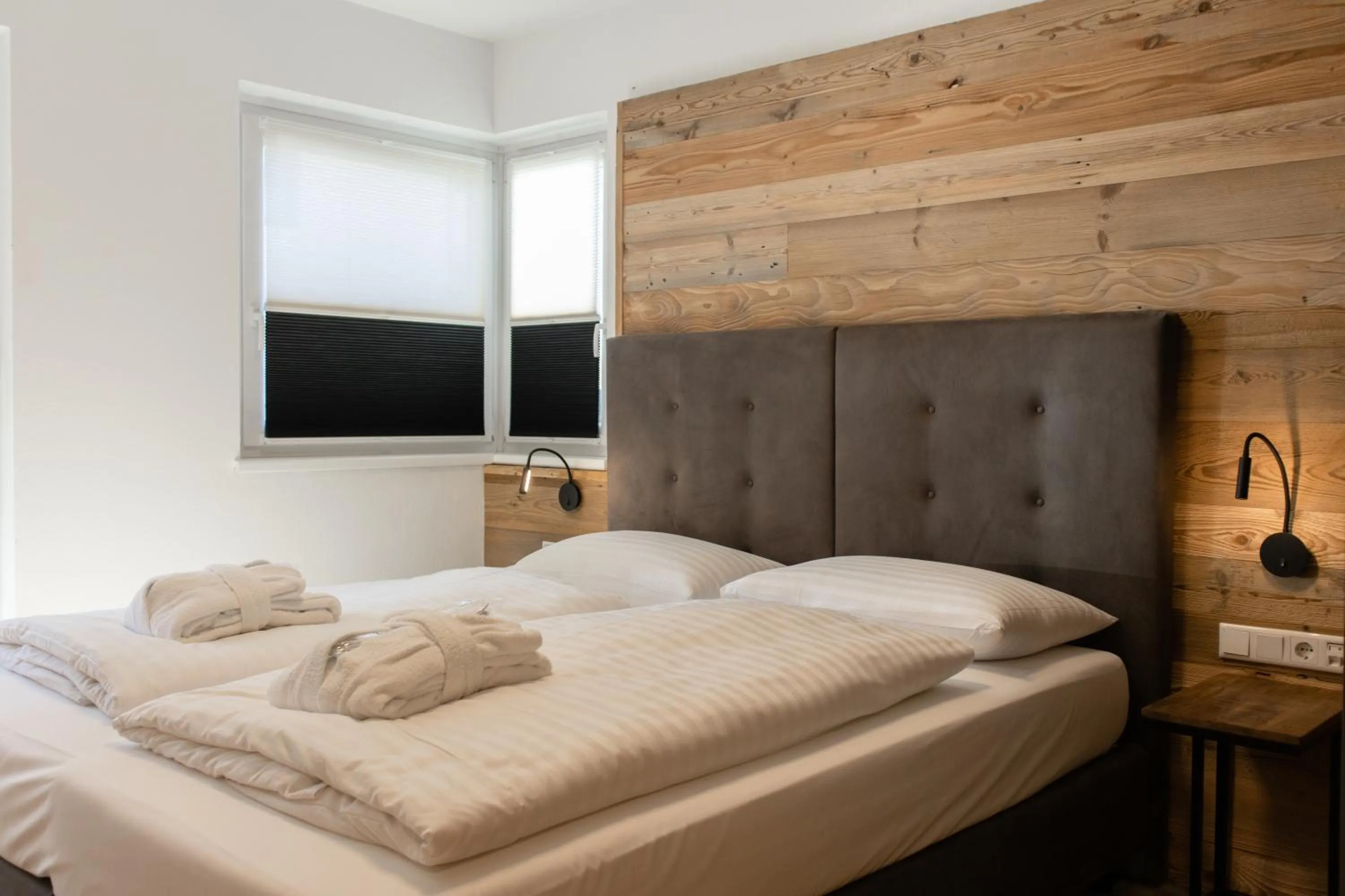 Bed in AvenidA Style Appartements by Alpin Rentals