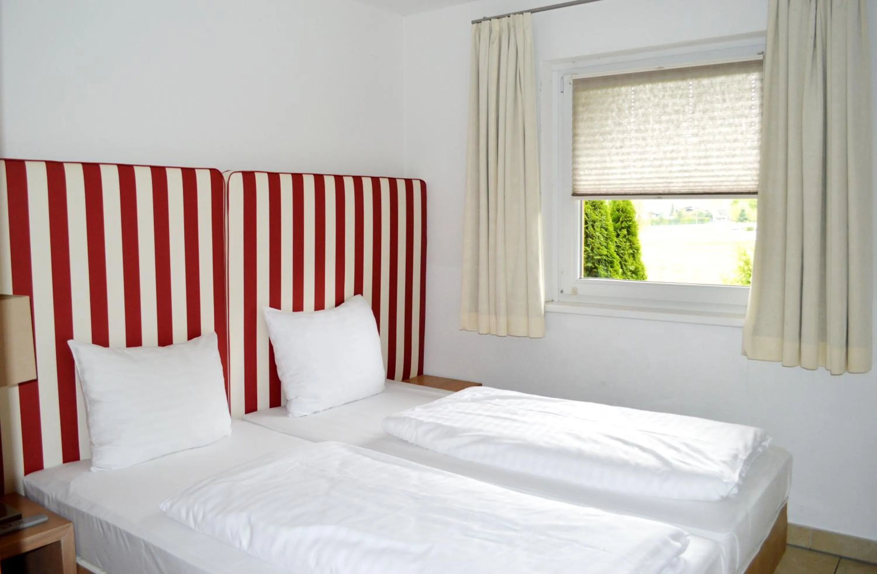 Bed in AvenidA Style Appartements by Alpin Rentals