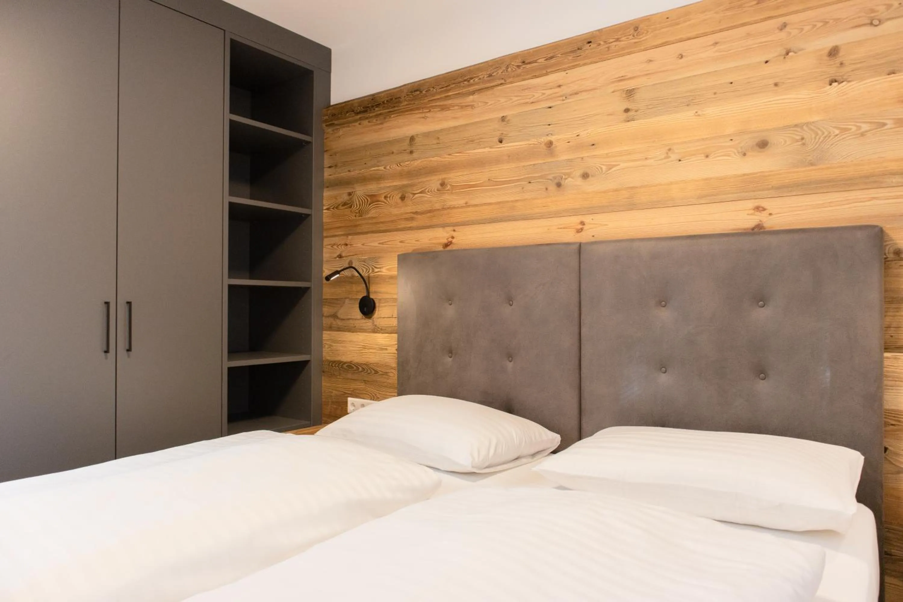 Bed in AvenidA Style Appartements by Alpin Rentals