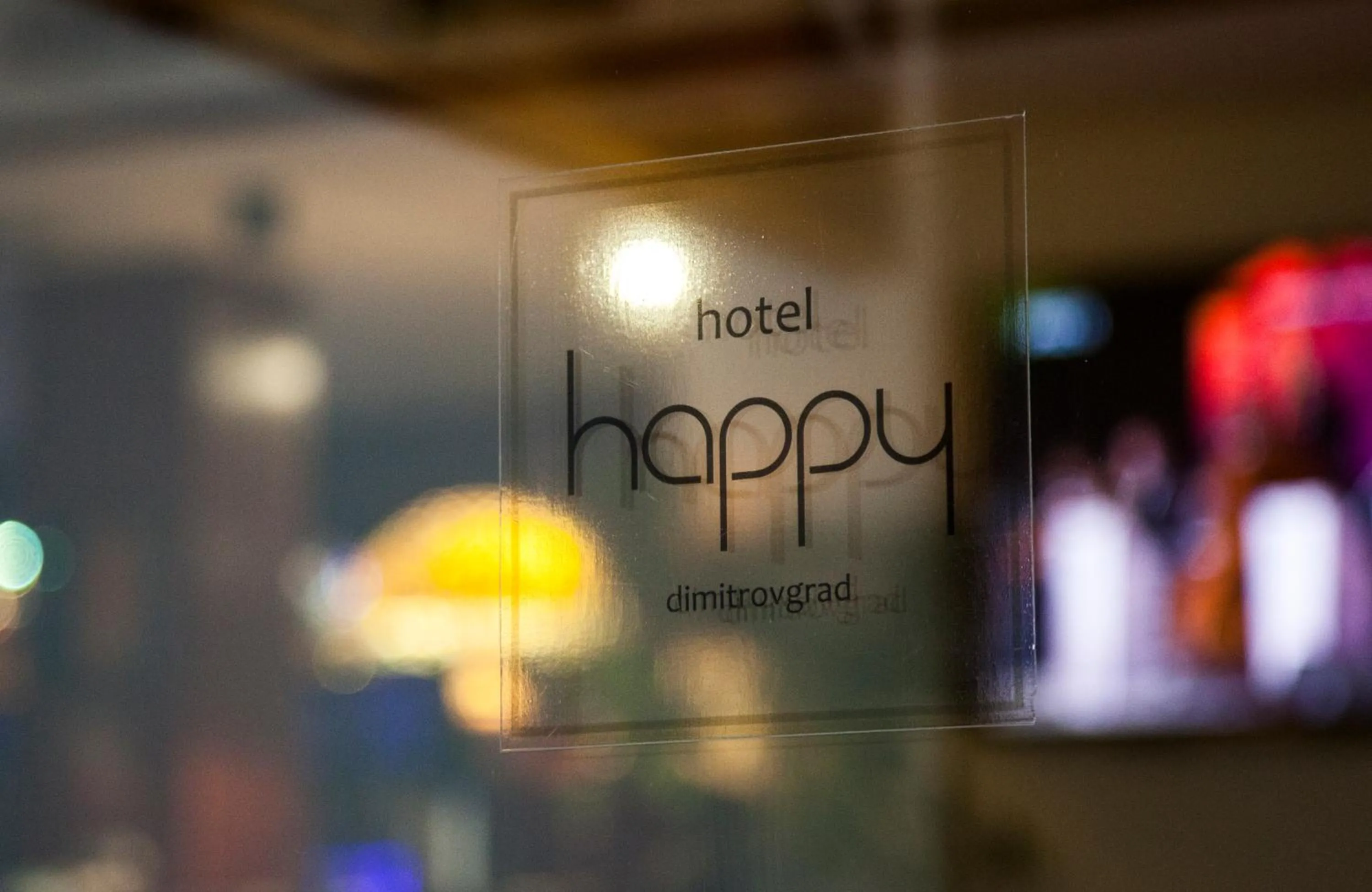 Property logo or sign in Hotel Happy