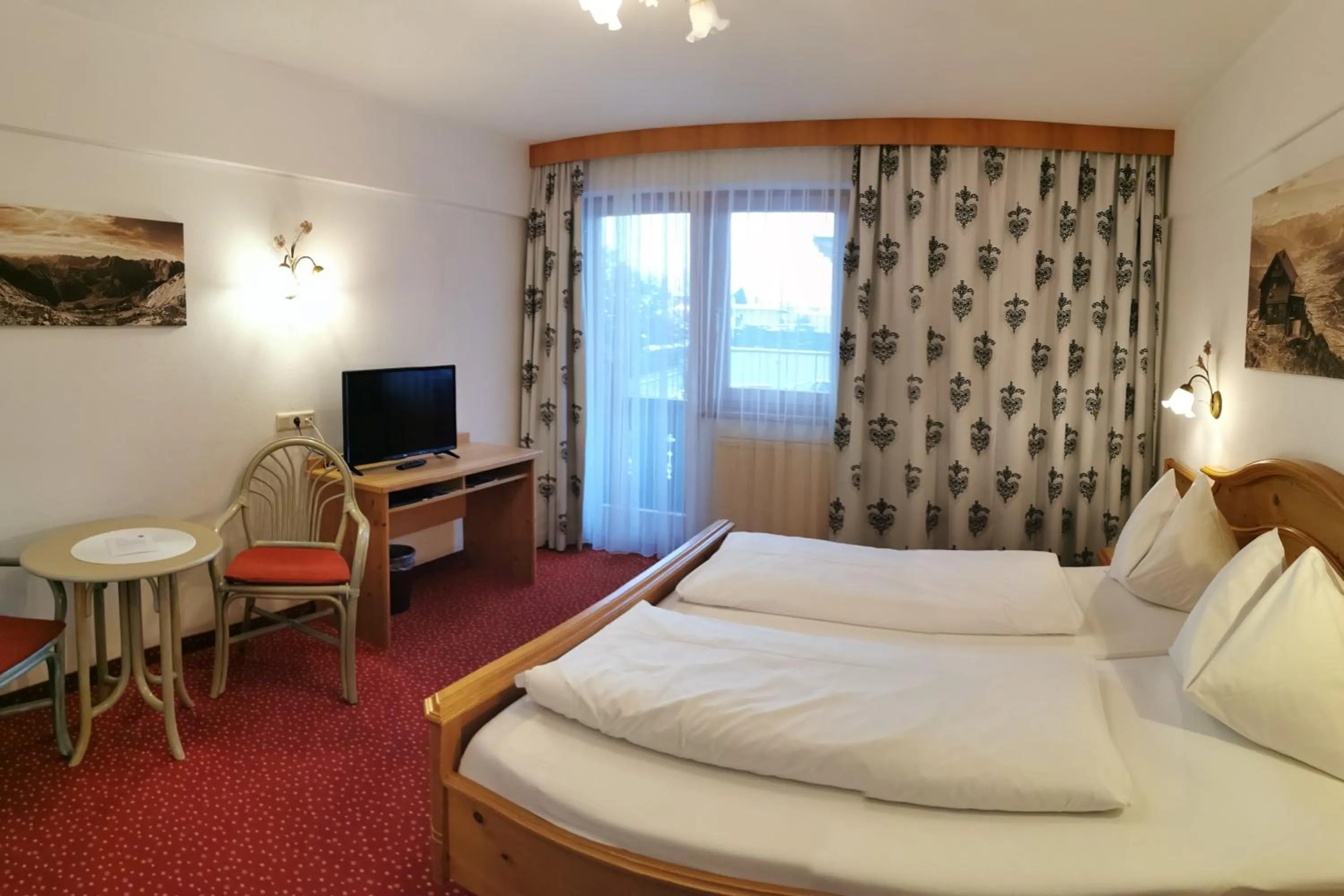 Photo of the whole room, Bed in Hotel Landhaus Zillertal