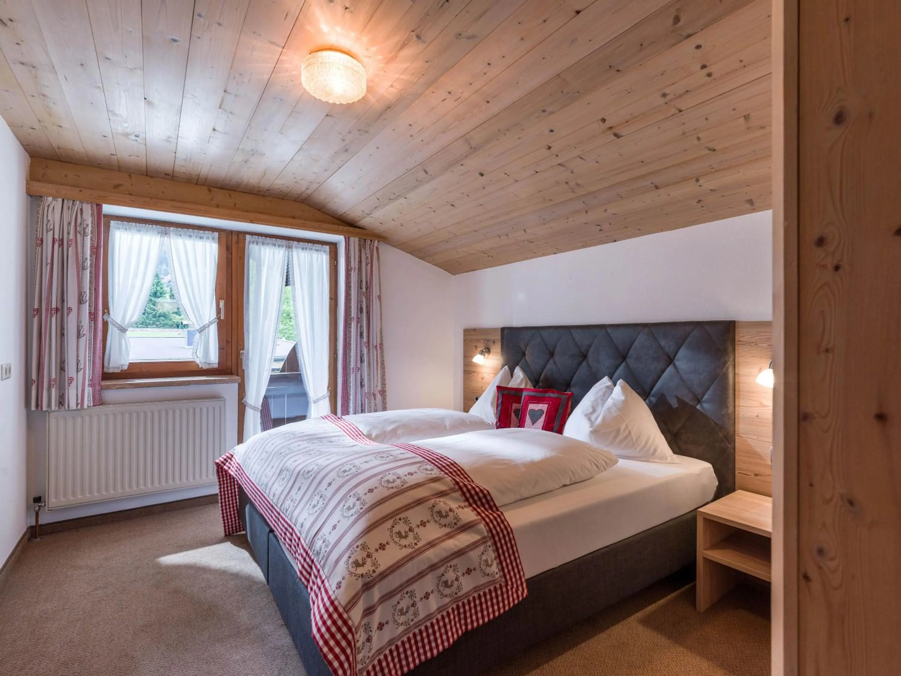 Photo of the whole room, Bed in Hotel Landhaus Zillertal