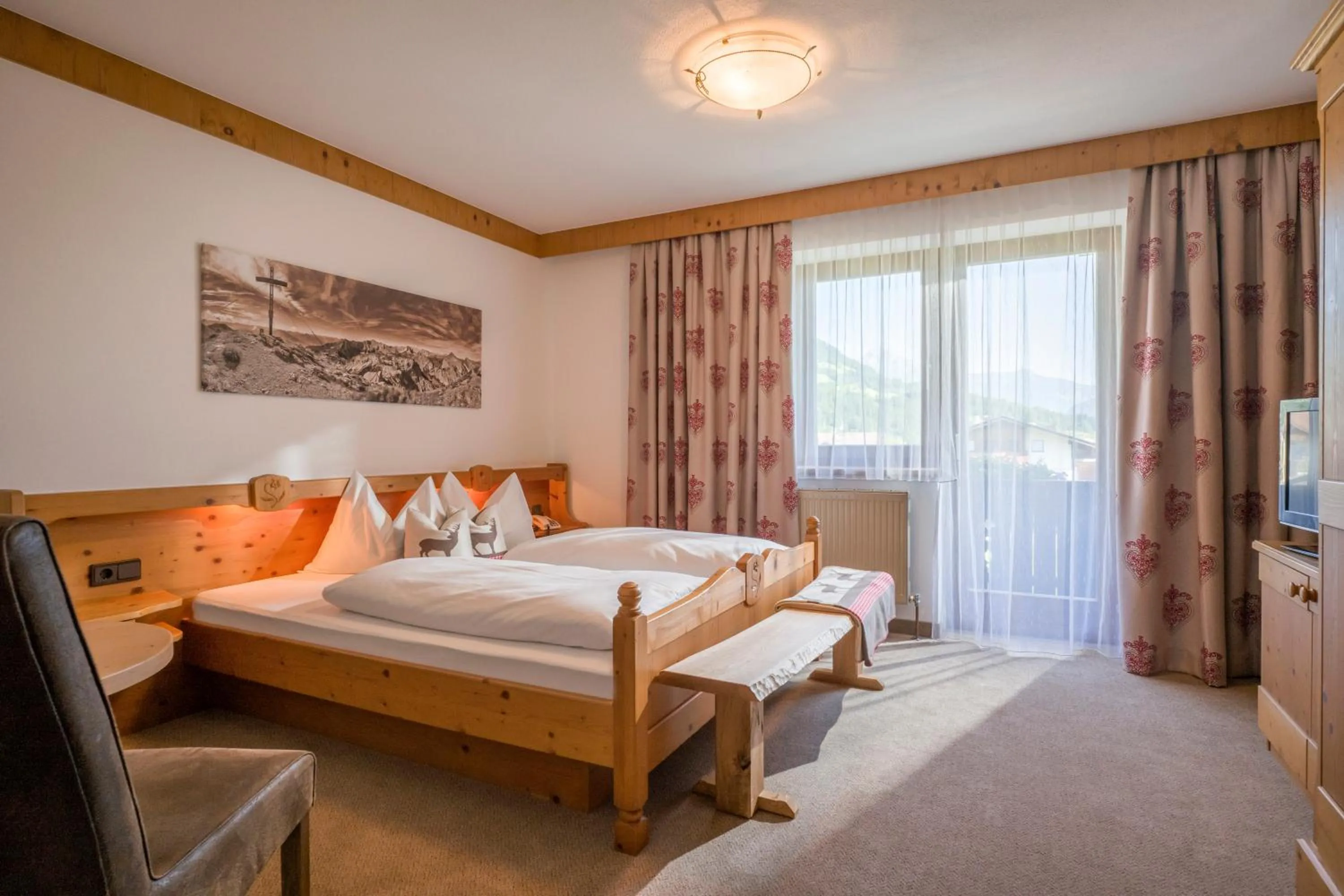 Photo of the whole room, Bed in Hotel Landhaus Zillertal