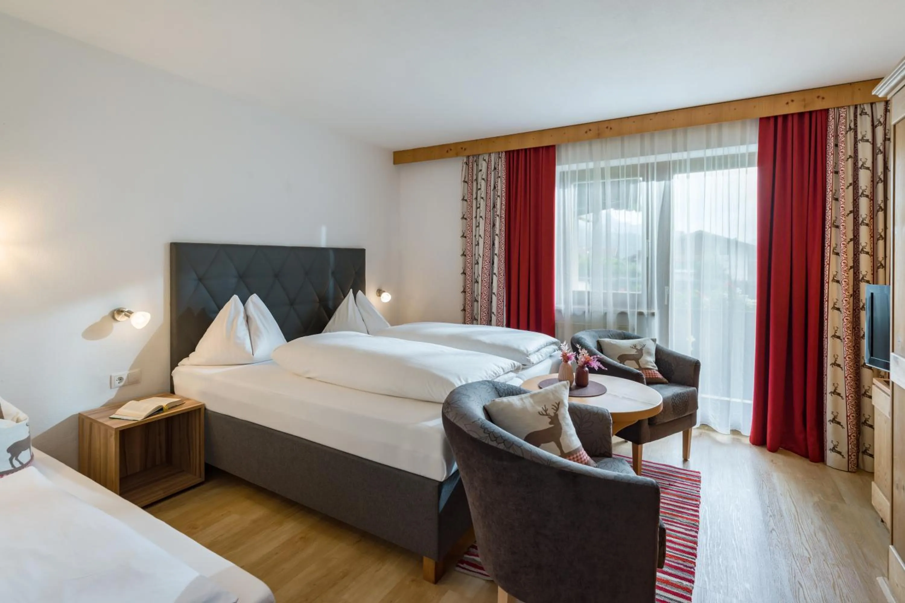 Photo of the whole room, Bed in Hotel Landhaus Zillertal