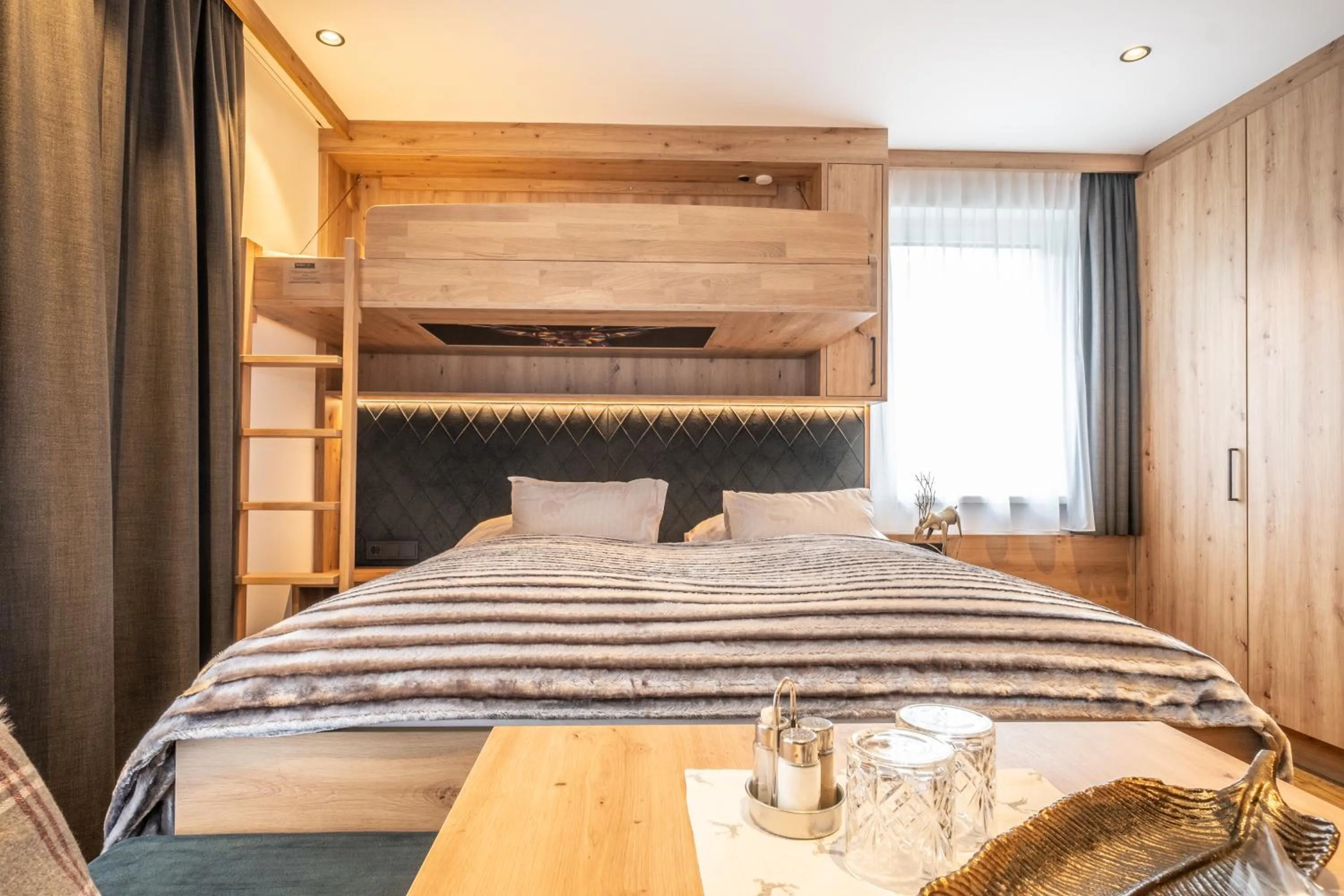 Bed in Dorfkrug Kaprun - Luxury Suites & Appartements