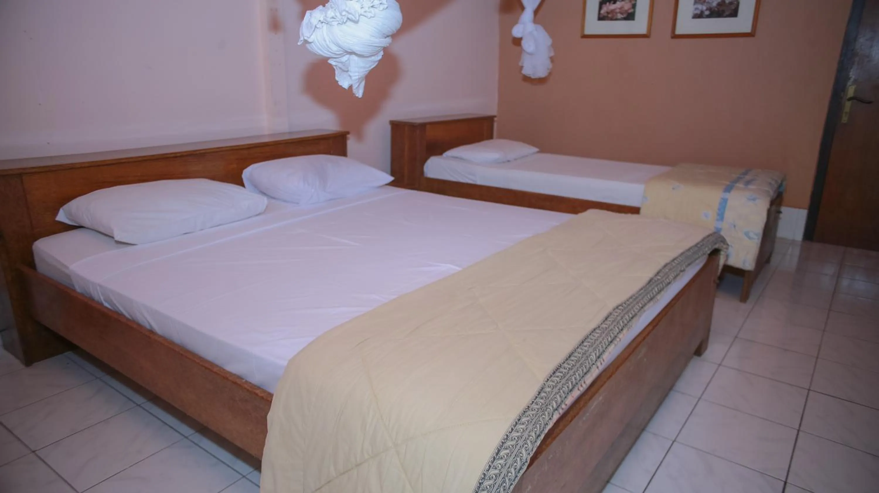 Bed in Sea World Club Beach Resort & Dive Center, RESORT THAT SUPPORTS THE POOR