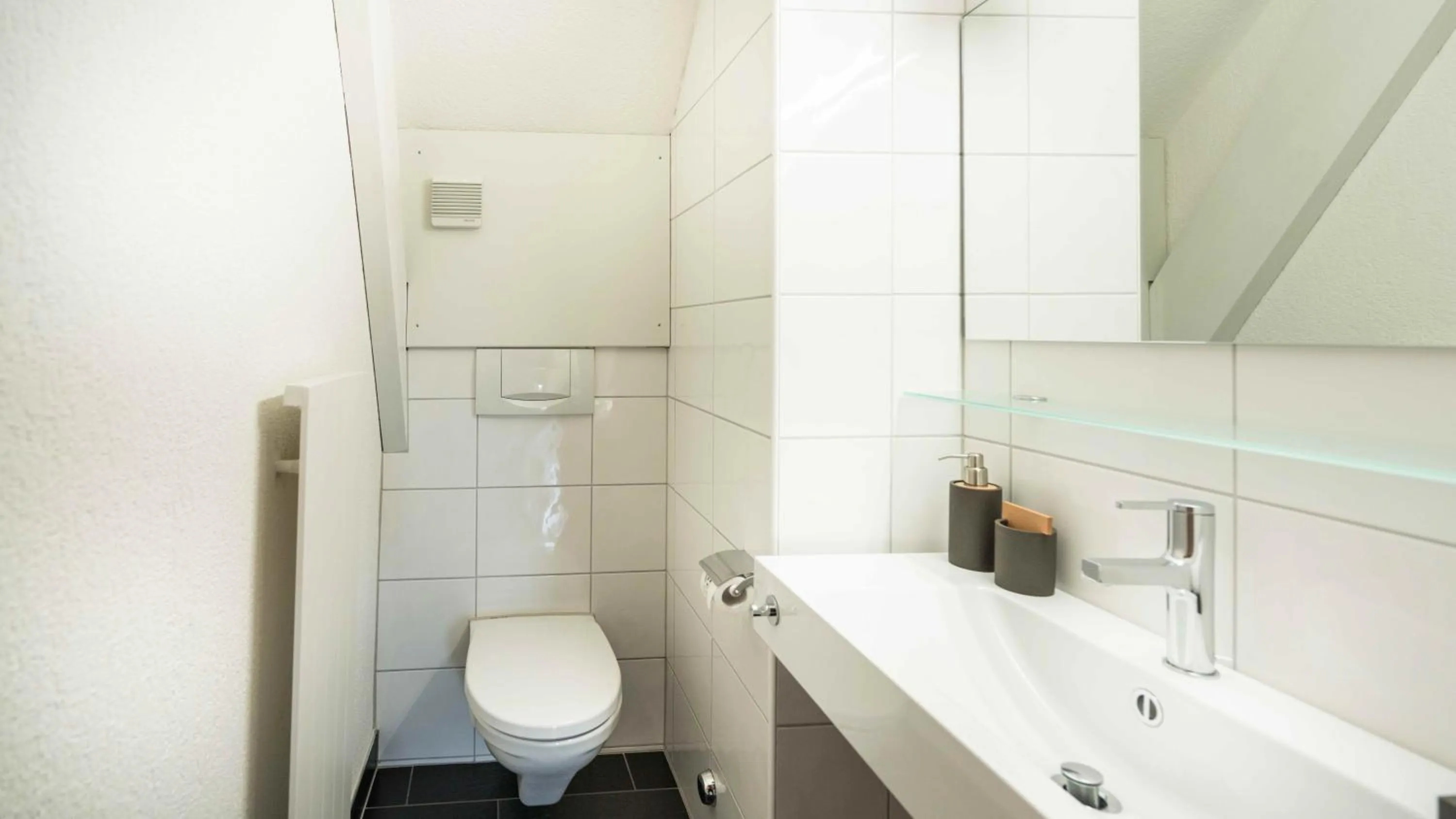 Toilet in Löwenplatz Apartment near Station by Airhome