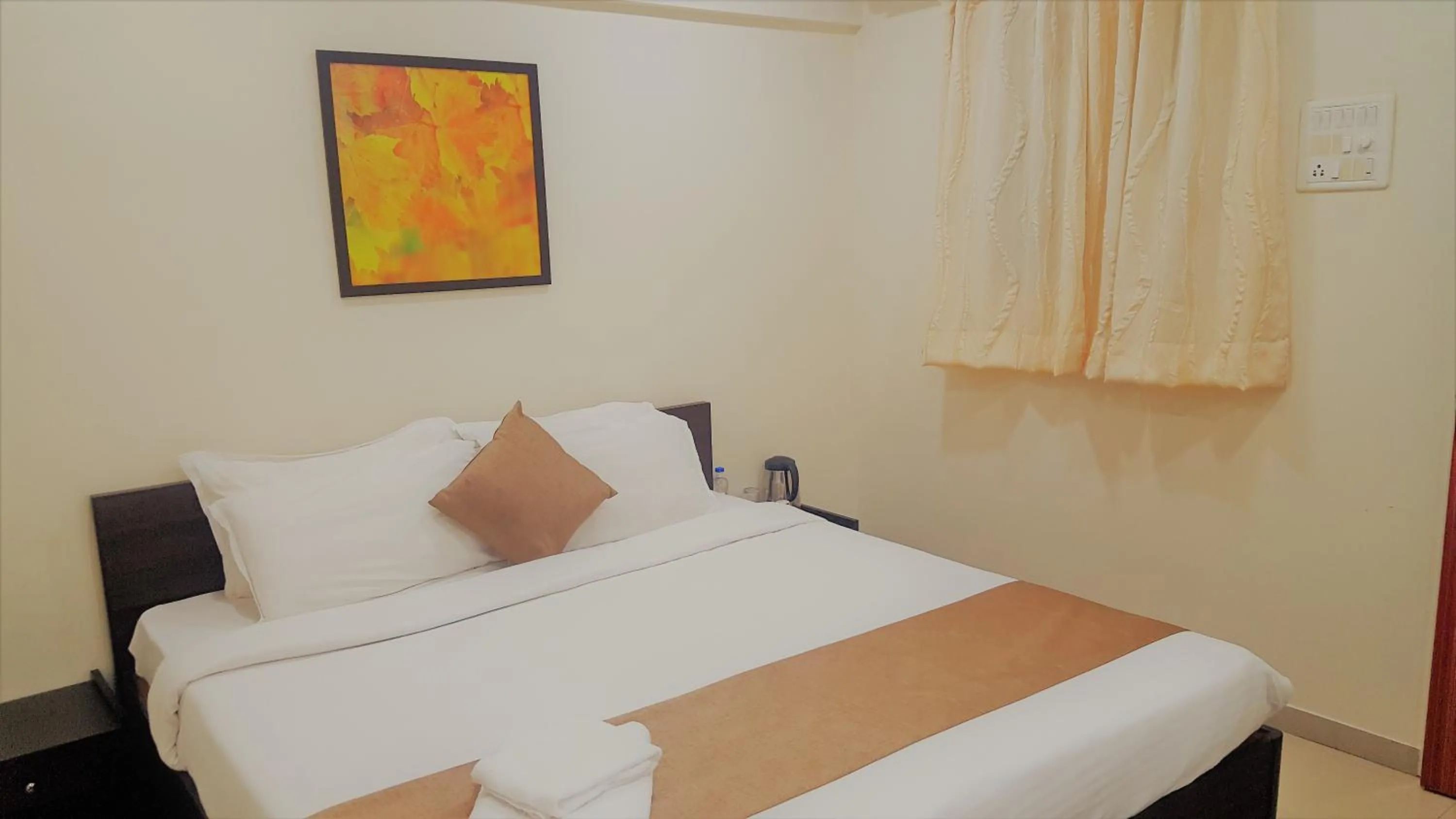 Bed in Dragonfly Apartments Emerald