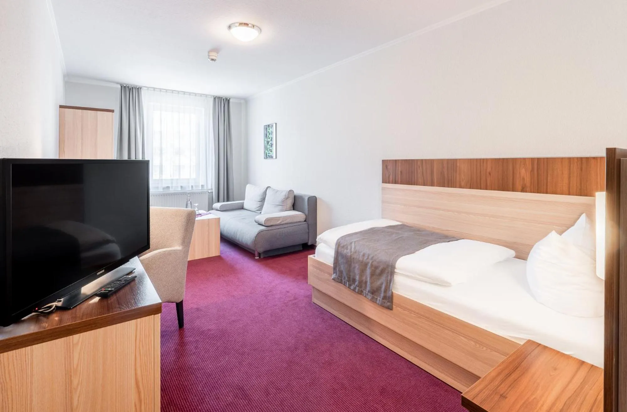 Photo of the whole room, Bed in Sporthotel Neuruppin