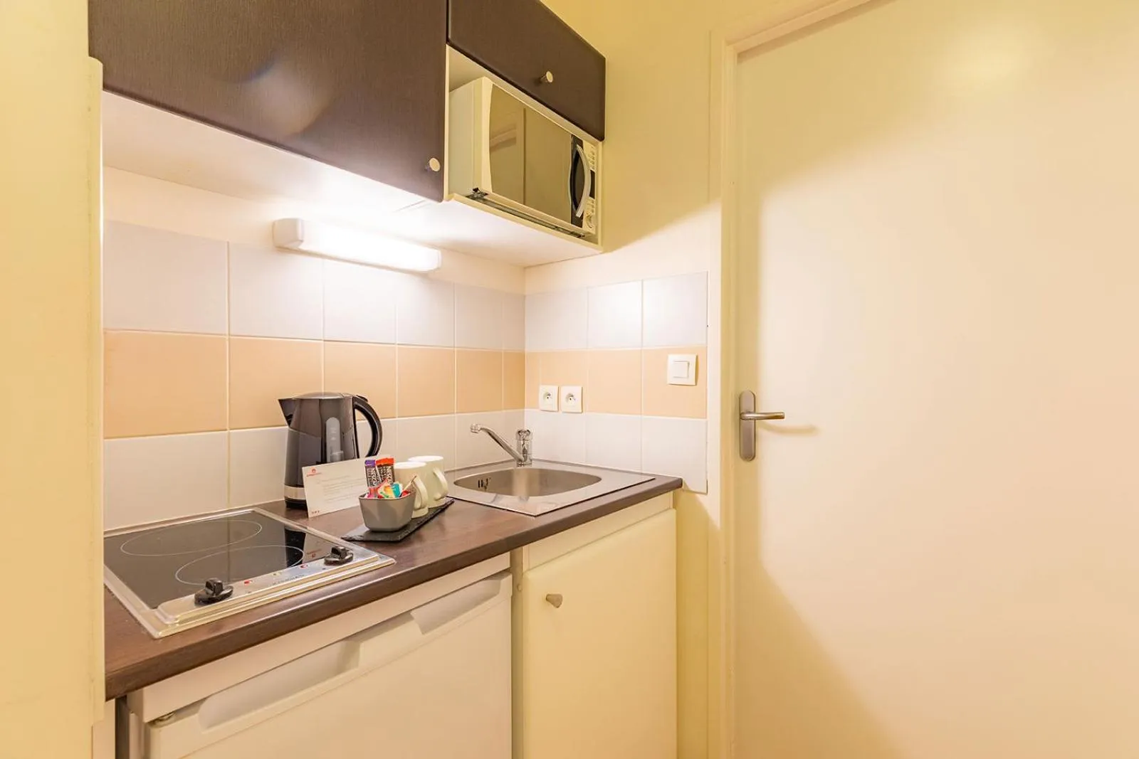 Kitchen or kitchenette in Appart’City Confort Nantes Centre