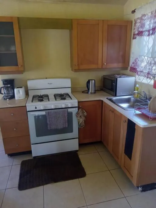 Coffee/tea facilities in Cheerful 2-Bedroom Home in Falmouth Garden