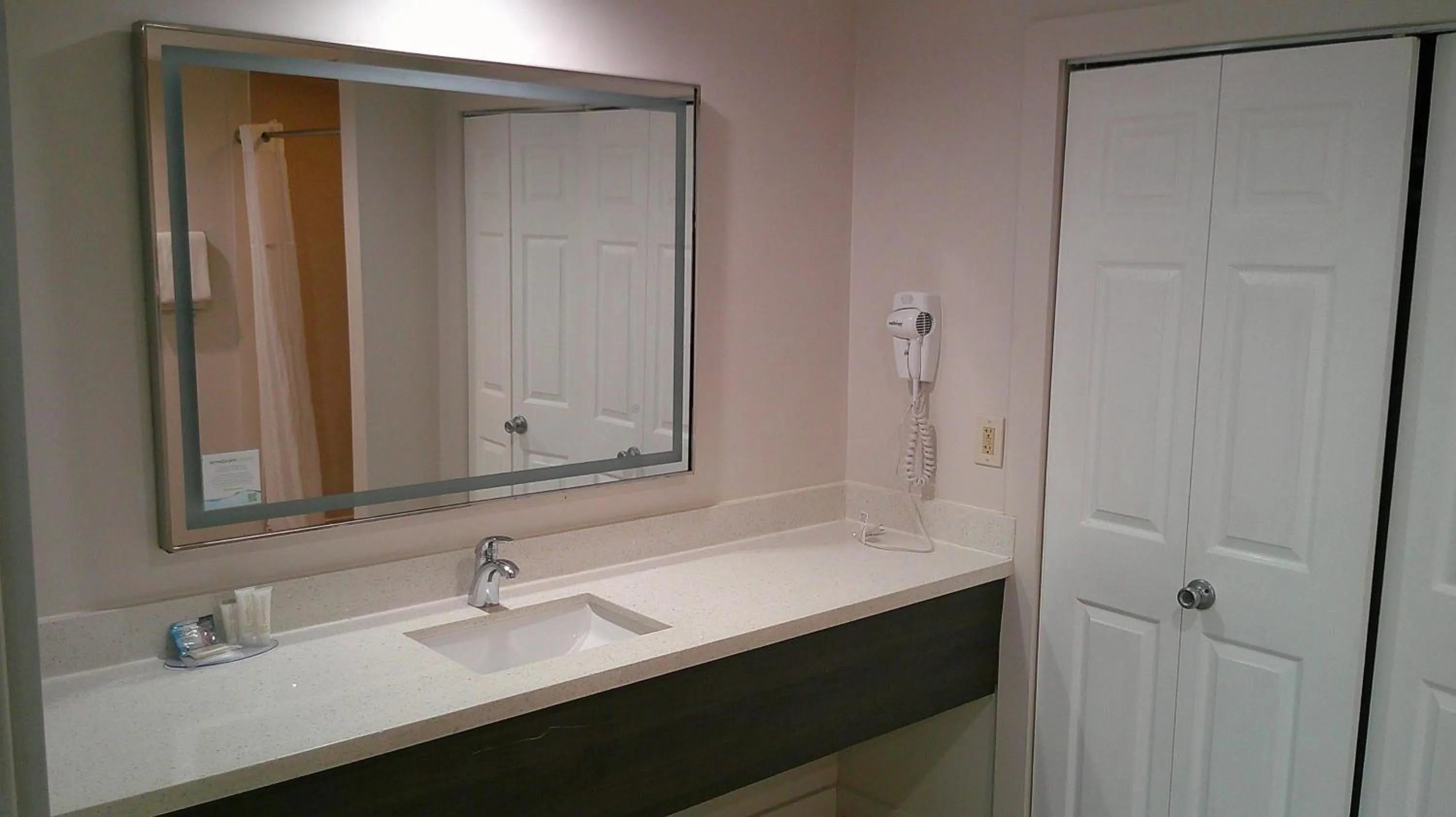 Bathroom in HOM Hotel Gainesville, SureStay Collection by Best Western