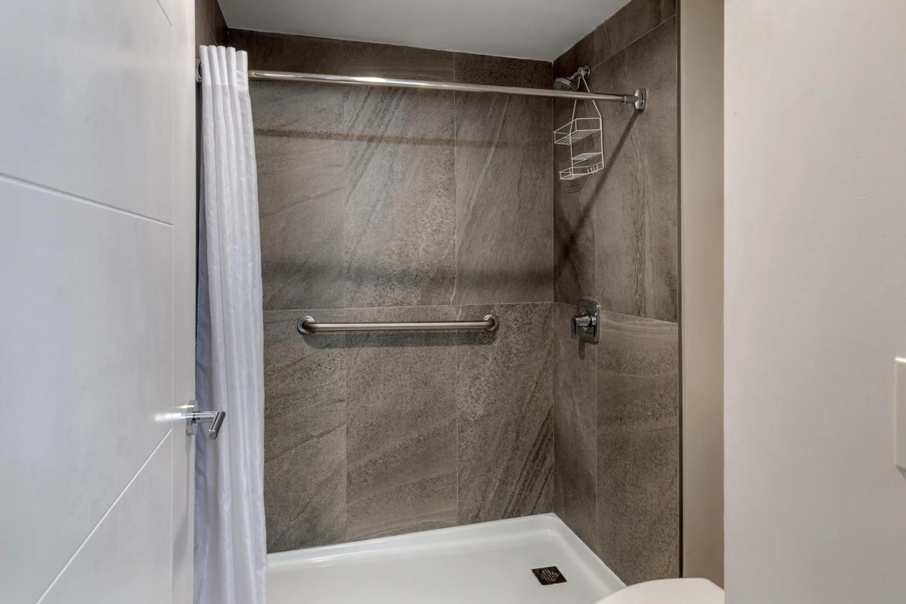 Bathroom in HOM Hotel Gainesville, SureStay Collection by Best Western